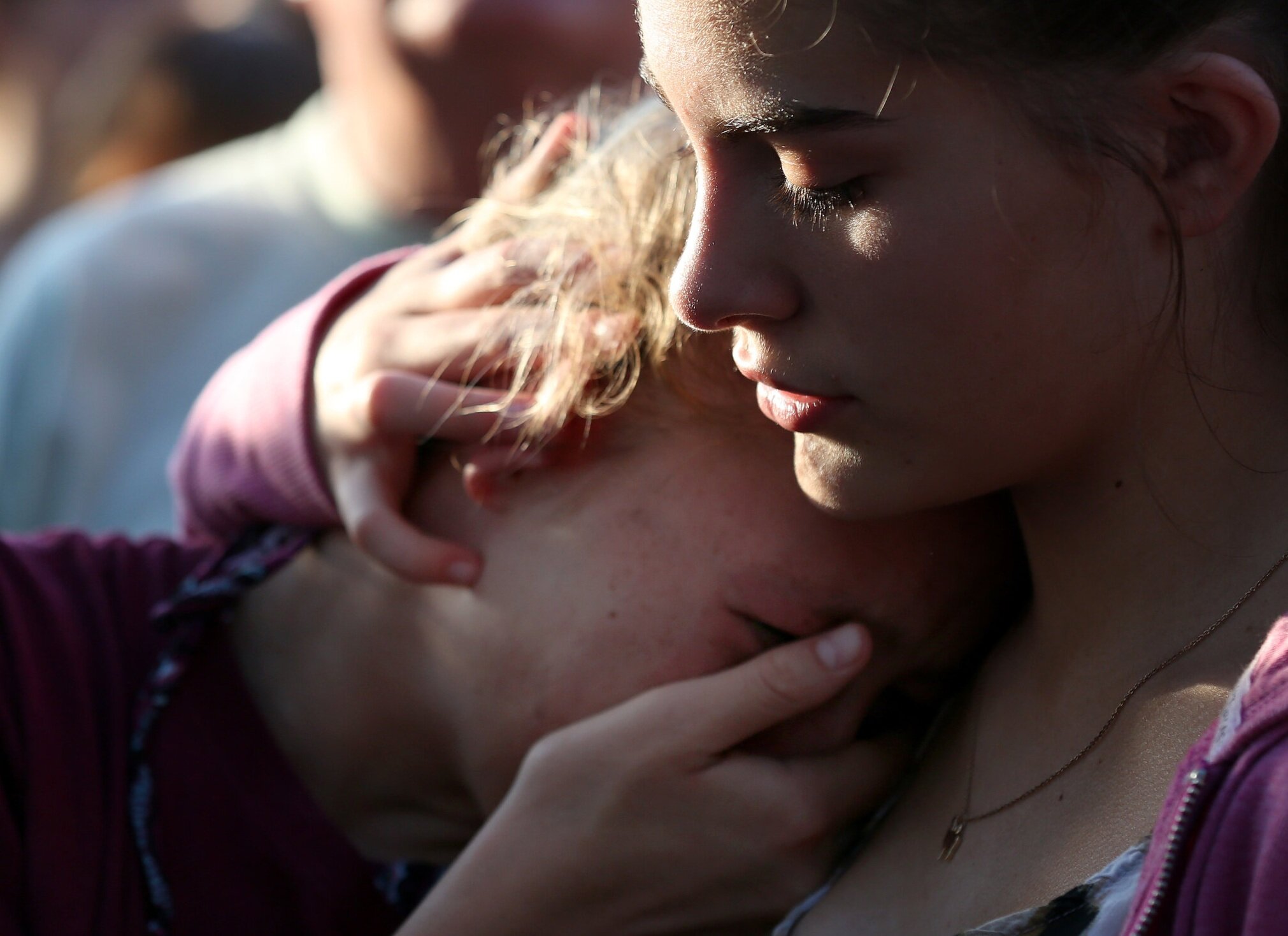  Abigail Adams, right, comforts her friend Hannah Hershey, 13, during a vigil for the victims of the Santa Fe High School mass shooting Friday, May 18, 2018, in Santa Fe, Texas. Hershey said she knew one of the 10 people who were killed at the high s