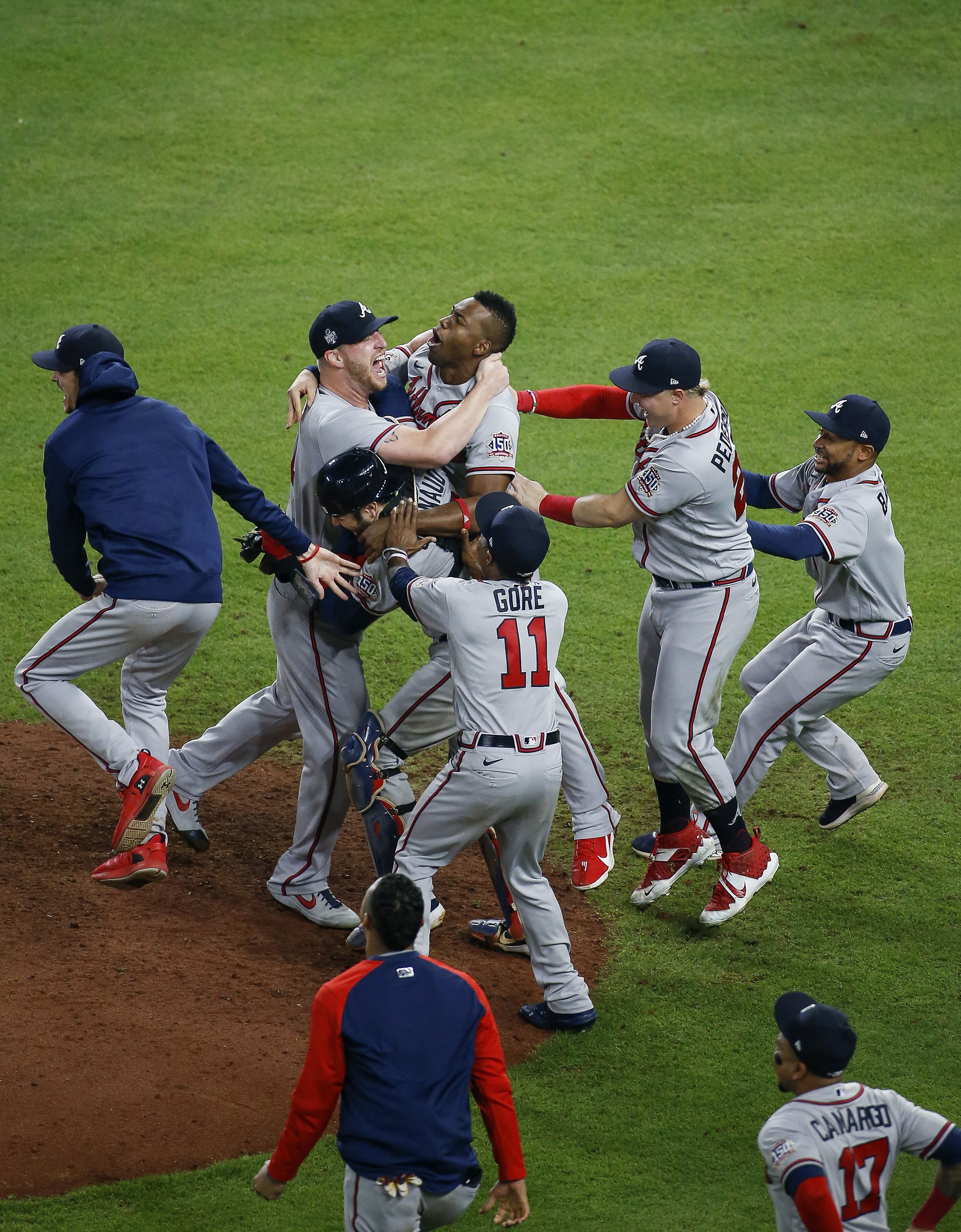  Atlanta Braves players celebrate near the mound after winning the World Series by defeating the Houston Astros 7-0 at Minute Maid Park on Tuesday, Nov. 2, 2021, in Houston. 