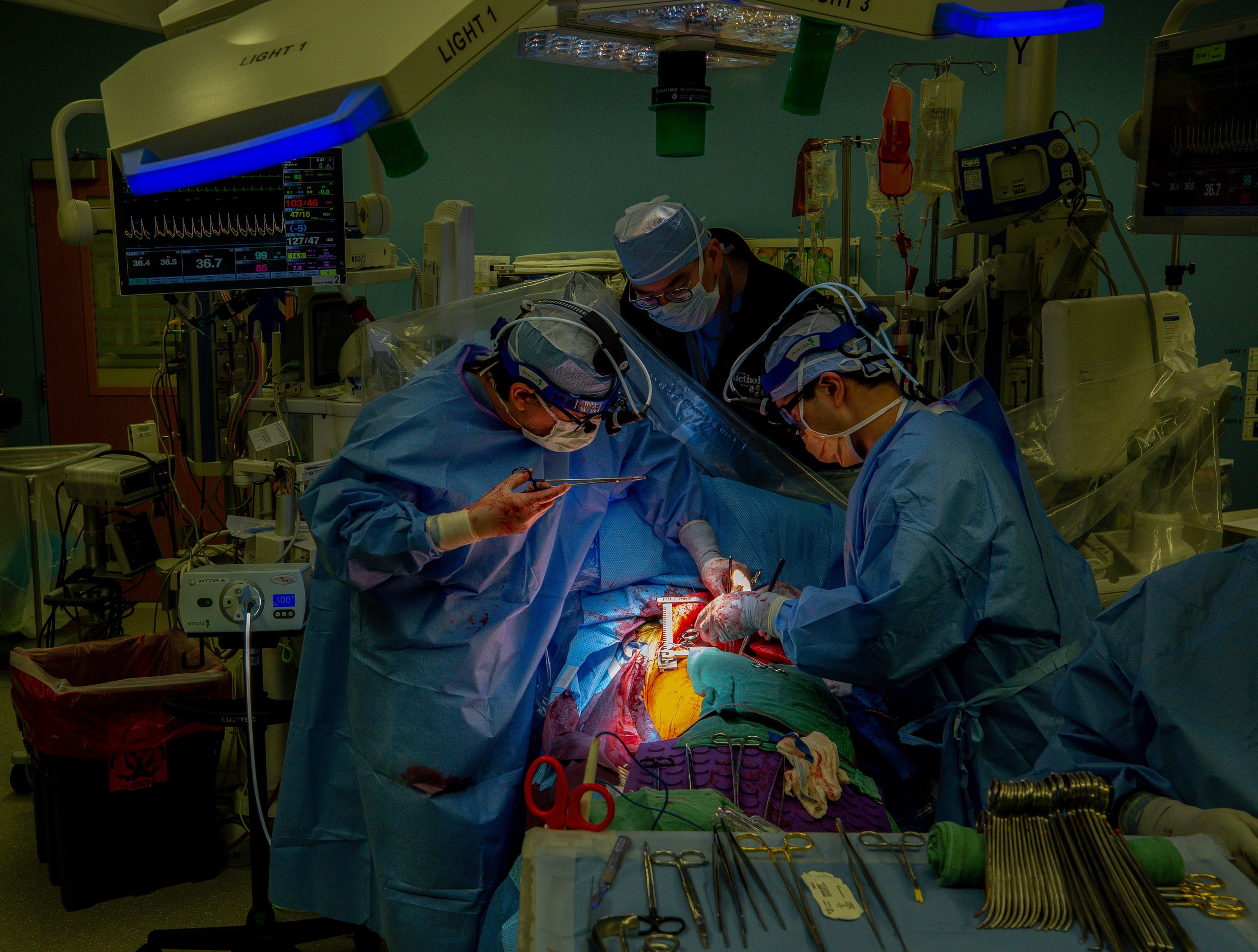  Dr. Erik Suarez, left, and assistant thoracic surgeon Ray Chihara, right, attach the right donor lung to Jesus' chest by suturing the airway and pulmonary arteries back together on Saturday, Nov. 20, 2021, in Houston, Texas.  