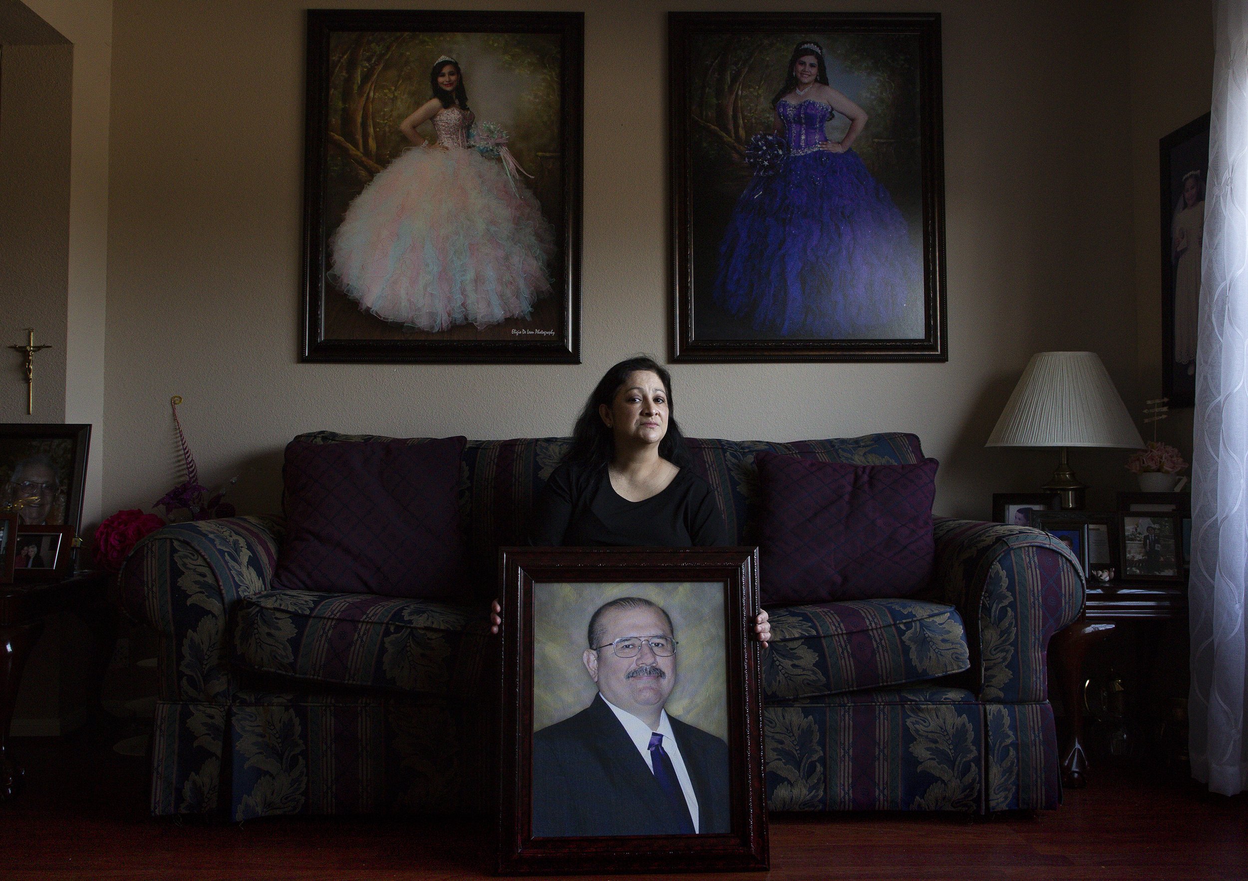  Maria Ortiz poses for a photograph inside her home on Thursday, Jan. 7, 2021, in Houston, Texas. Her husband, Erick Ortiz, died of COVID-19 in early December. His family worries he contracted it at Milby High School, where they say the principal ign