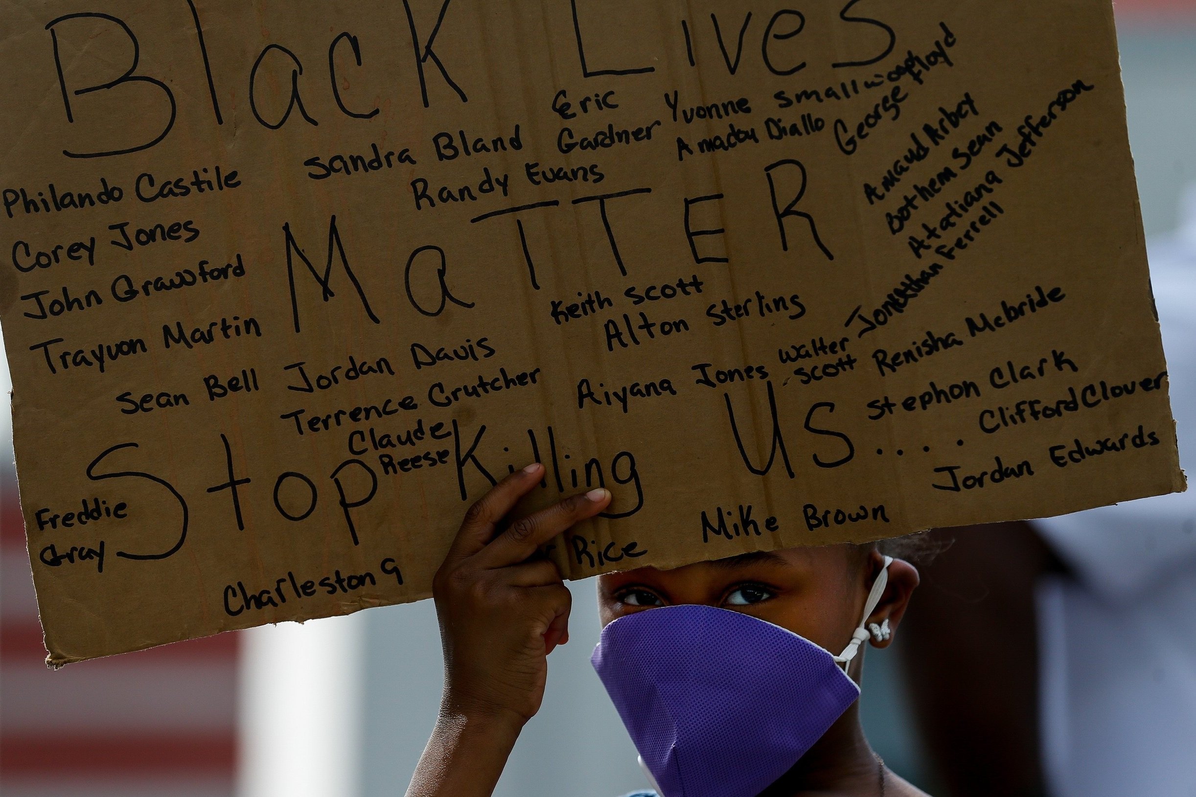  Kailia Allen, 8, holds a sign during a march to protest the death of former Houston resident George Floyd at Emancipation Park on Saturday, May 30, 2020, in Houston, Texas. Floyd died while in custody of the Minneapolis Police Department, after offi