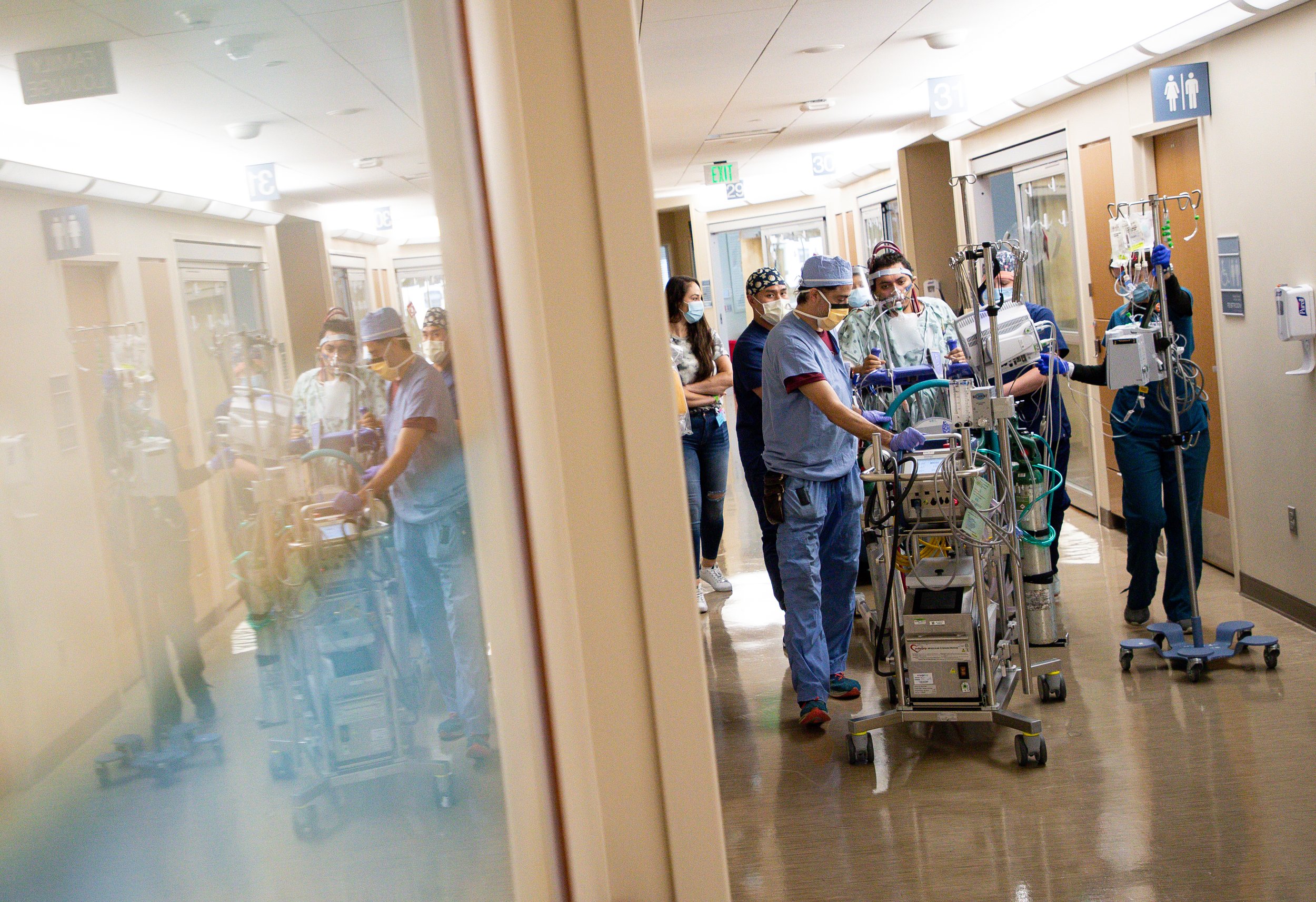  Jesus  – helped by a team of nurses, physical therapists and an ECMO specialist – walked down a hallway as he continued to work on regaining physical strength at Houston Methodist Hospital on Wednesday, Oct. 13, 2021, in Houston, Texas. 