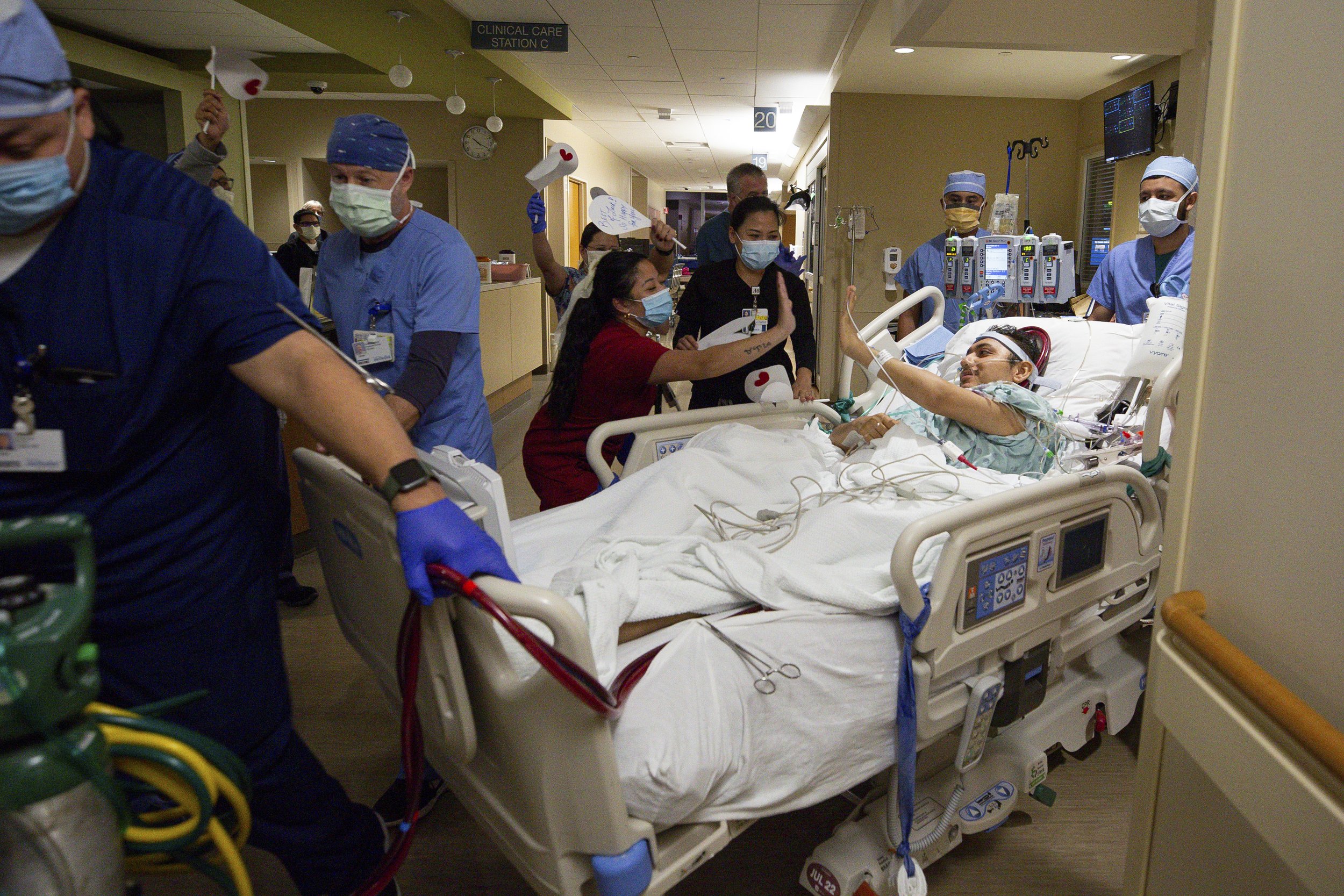  Jesus high-fives nurses as he is wheeled off to the operating room by the surgical team at Houston Methodist Hospital on Friday, Nov. 19, 2021, in Houston, Texas. 