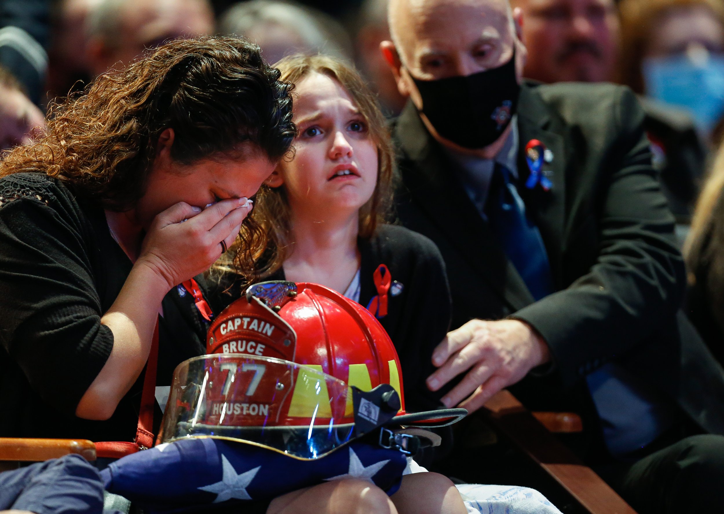  Rachel Bruce, left, and her daughter Sydney grieve as the Houston Fire Department honors her husband, arson investigator Lemuel Bruce, at a memorial service Lakewood Church on Thursday, Oct. 22, 2020, in Houston, Texas. Bruce, 44, died while he was 