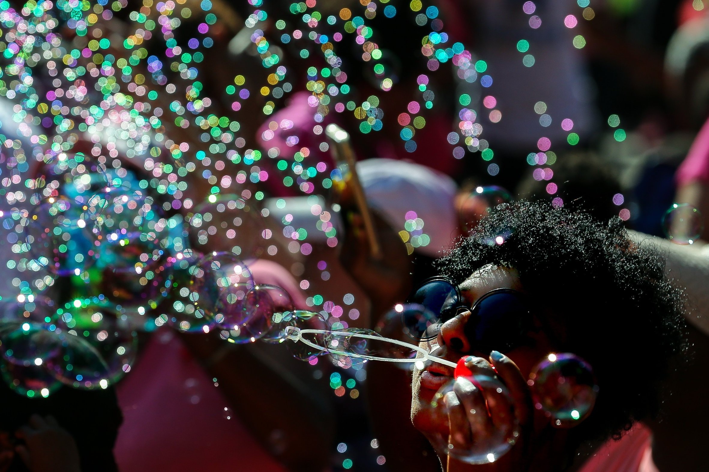  Trinity Newman blows bubbles along with thousands of people outside City Hall in honor of Maleah Davis, the four-year-old girl who went missing in early May and whose body was found tossed along an Arkansas roadside last week, on Sunday, June 9, 201