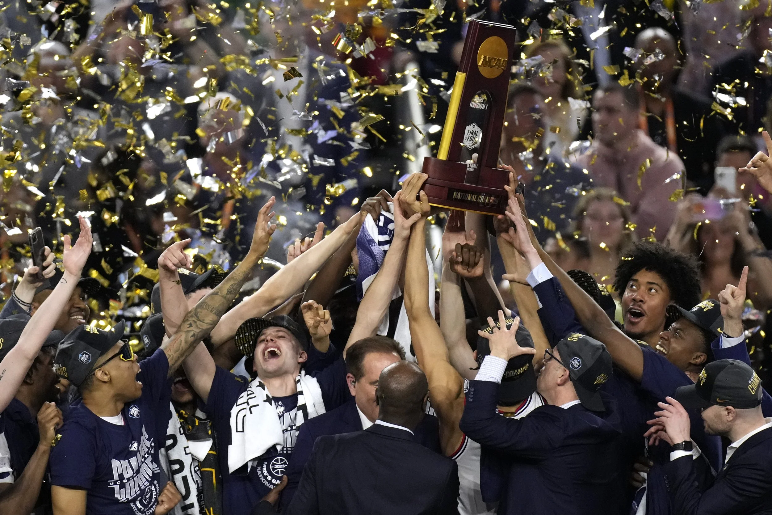 Connecticut players celebrate their win over San Diego State in the men's national championship college basketball game in the NCAA Tournament on Monday, April 3, 2023, in Houston. Connecticut won 76-59. (AP Photo/Godofredo A. Vasquez)