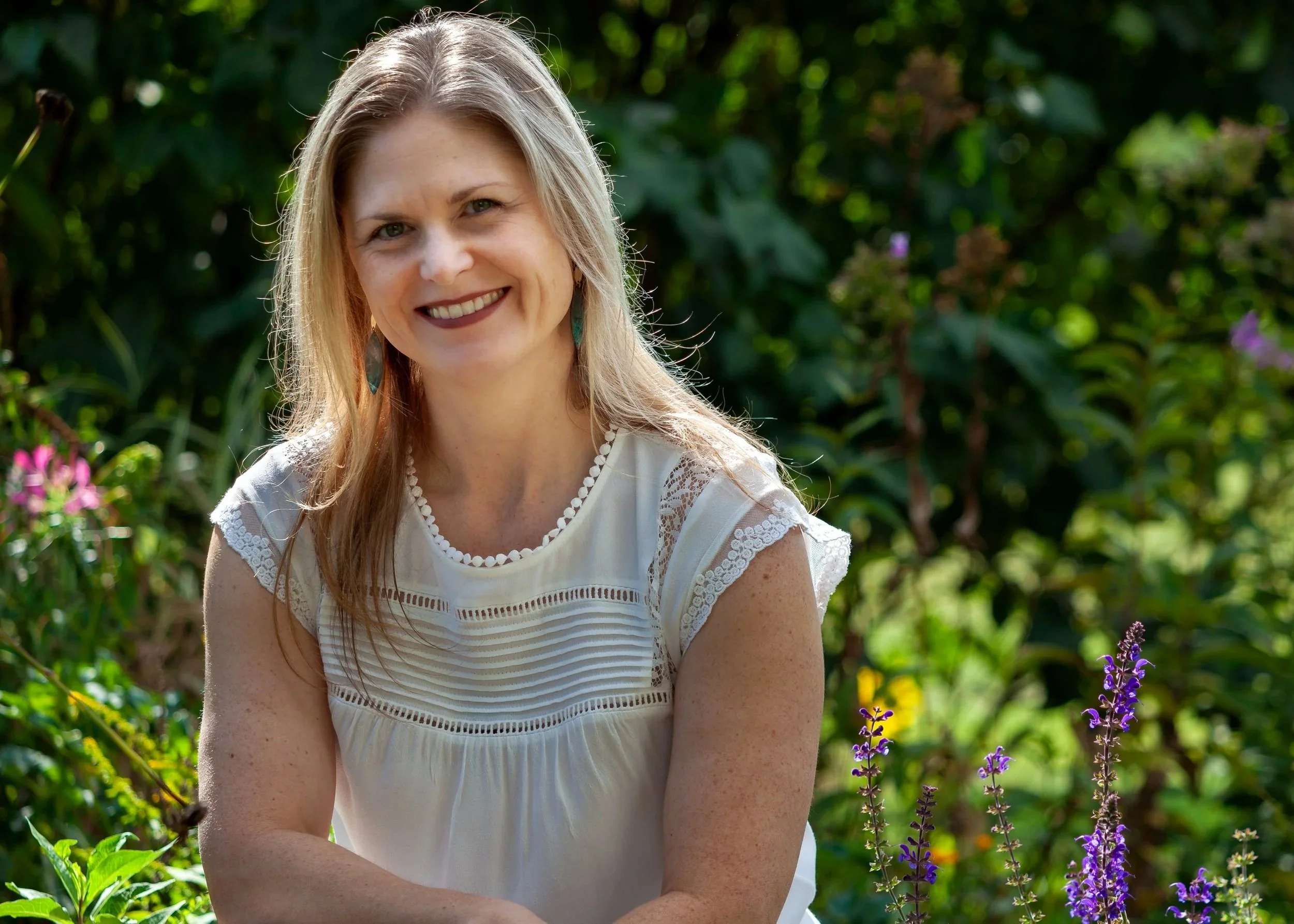 Environmental portrait of life coach Emily in a garden setting