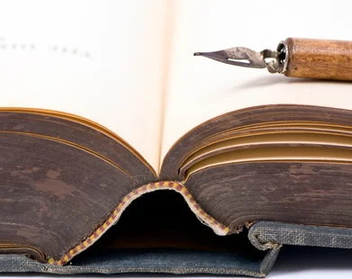 Old book and pen