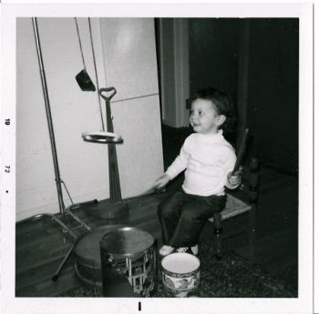 Amy at age 3. Who knew that drums would be my first instrument? I still play today!
