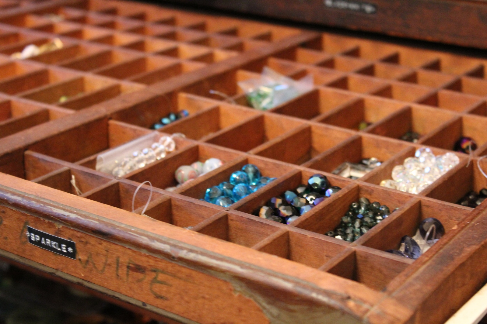 beads in vintage letterpress tray