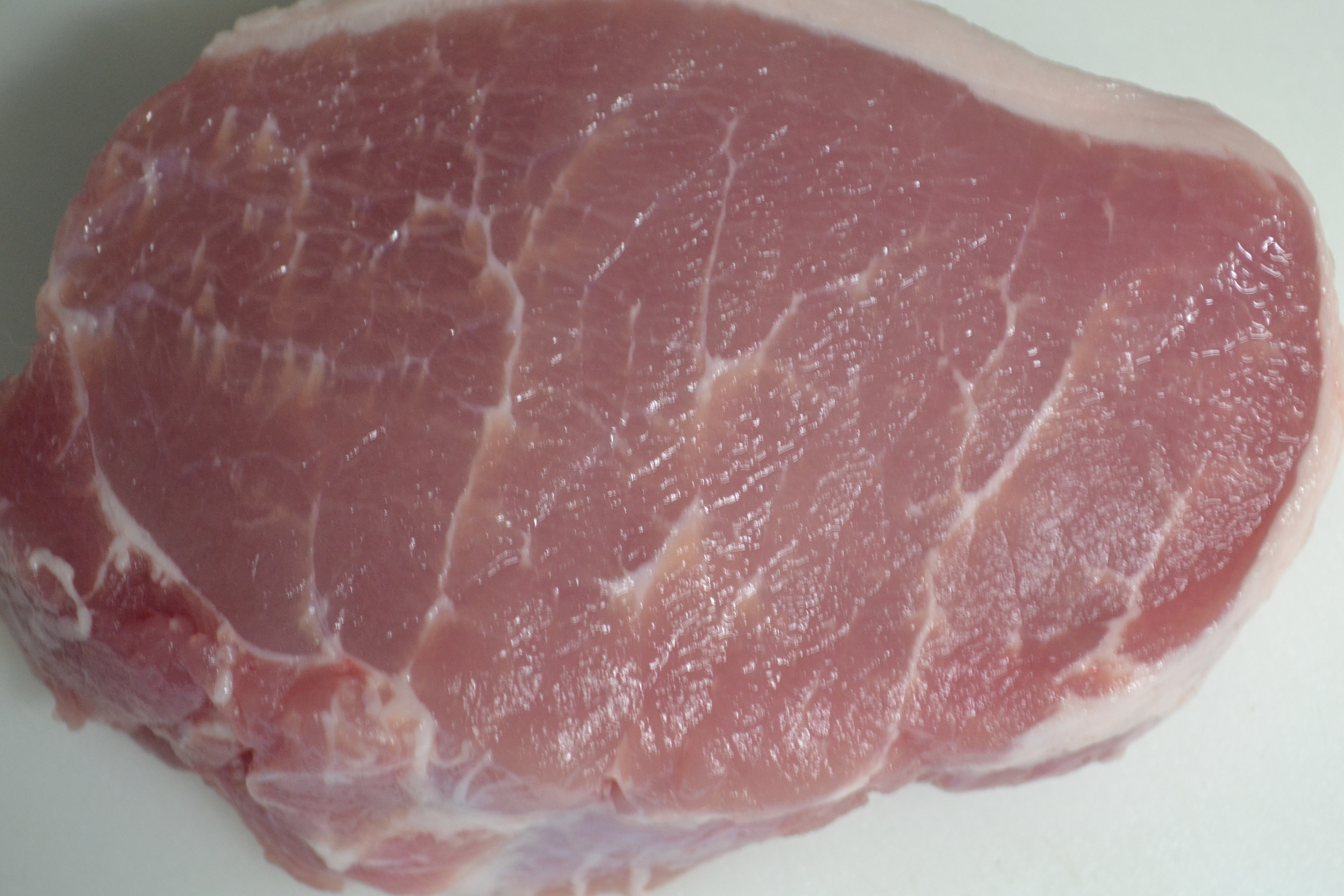 Simply put, the fat you see within the muscle of this boneless pork chop is marbling. 