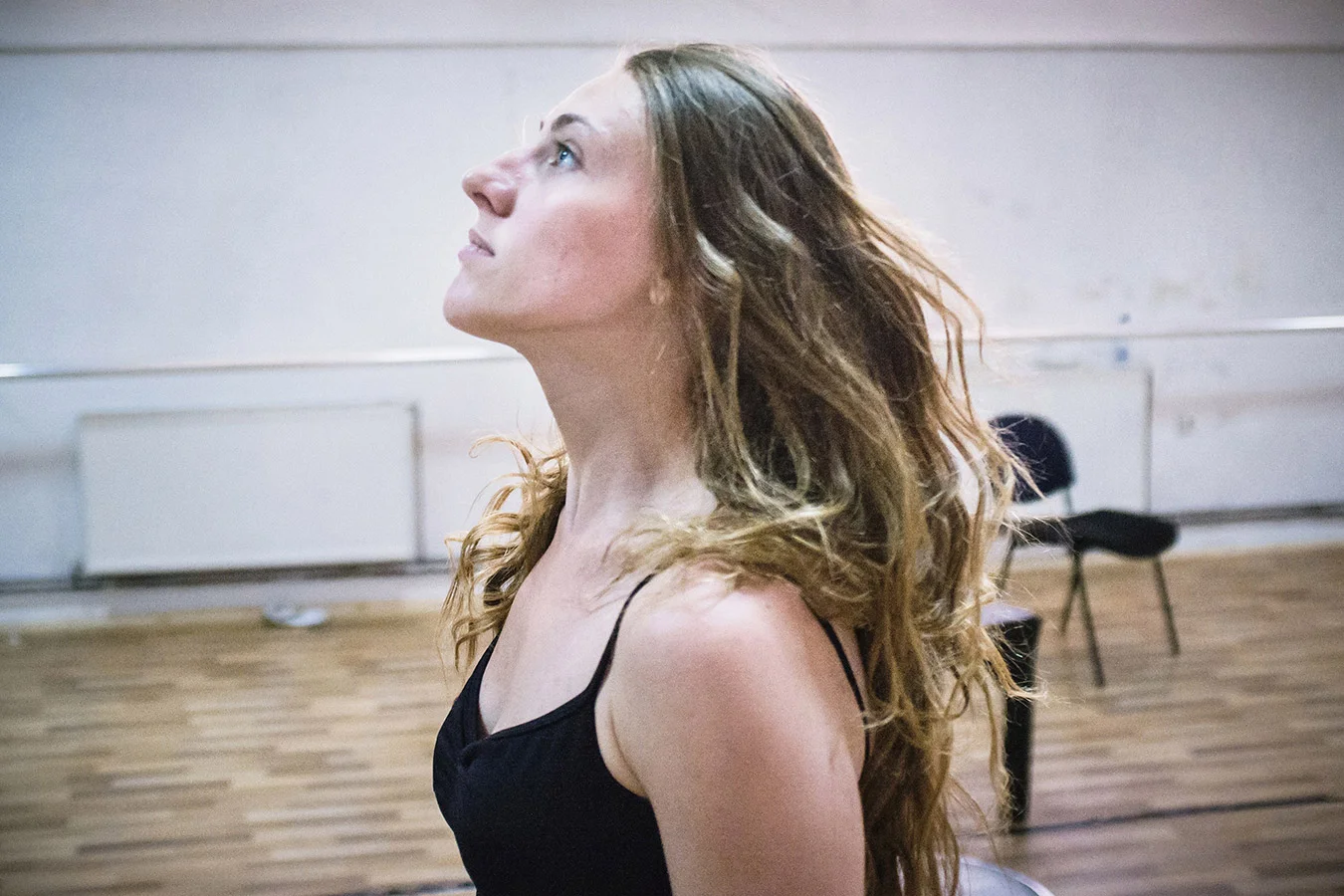 Vlora Prizreni, a member of the new generation of The Kosovo Ballet, during a daily rehearsal in the training room at the basement of Kosovo National Theater, Pristina.