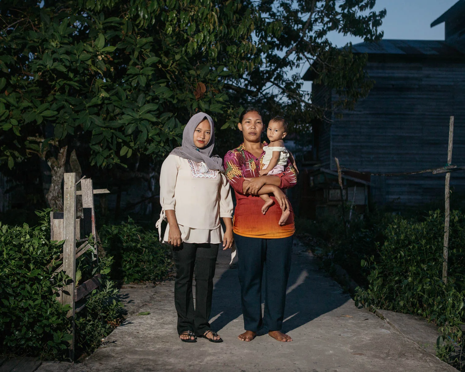 Portrait of Riska Asmaul Lifa (left) and Halisa (right), villagers from Mendawai who are benefited from Katingan Mentaya Project's micro credit program.