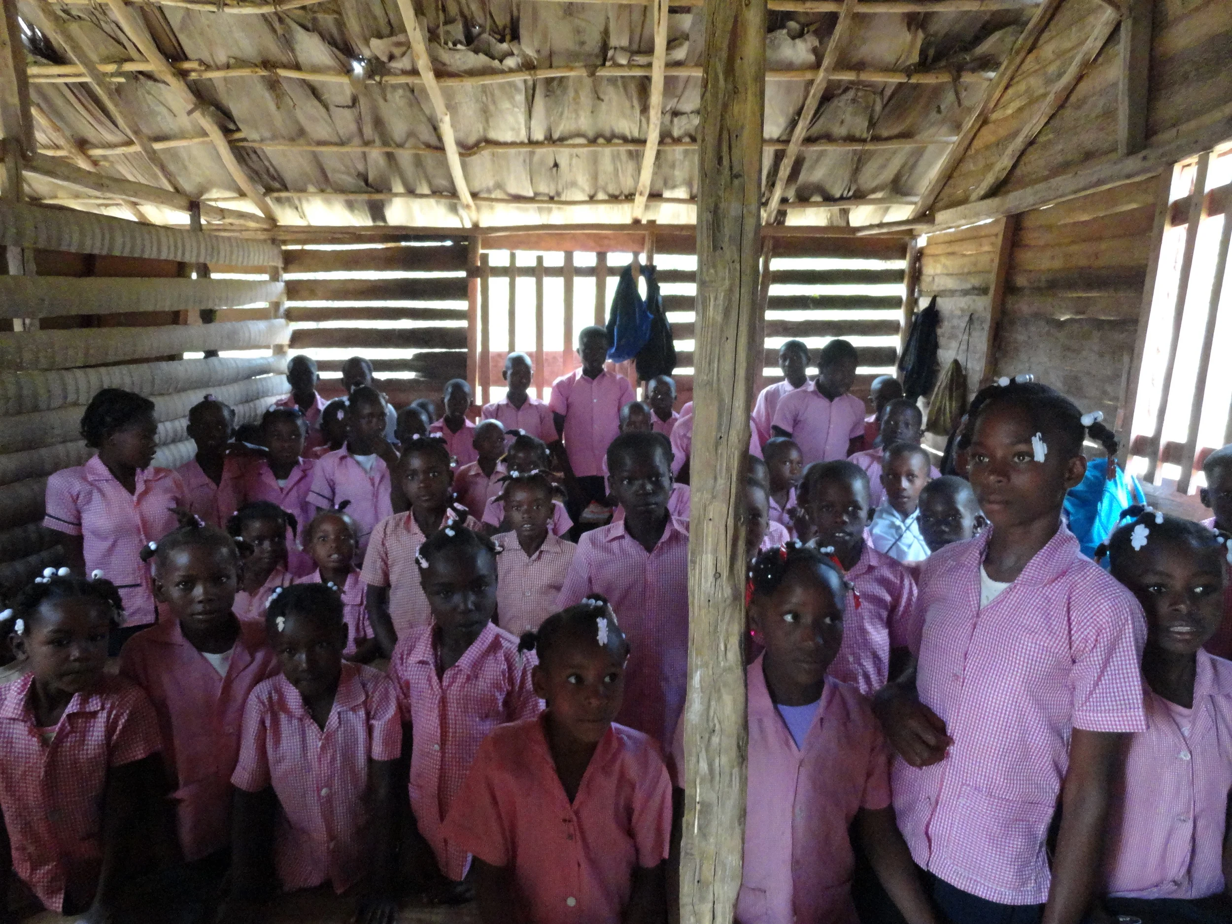 Crowded class in wooden building.JPG