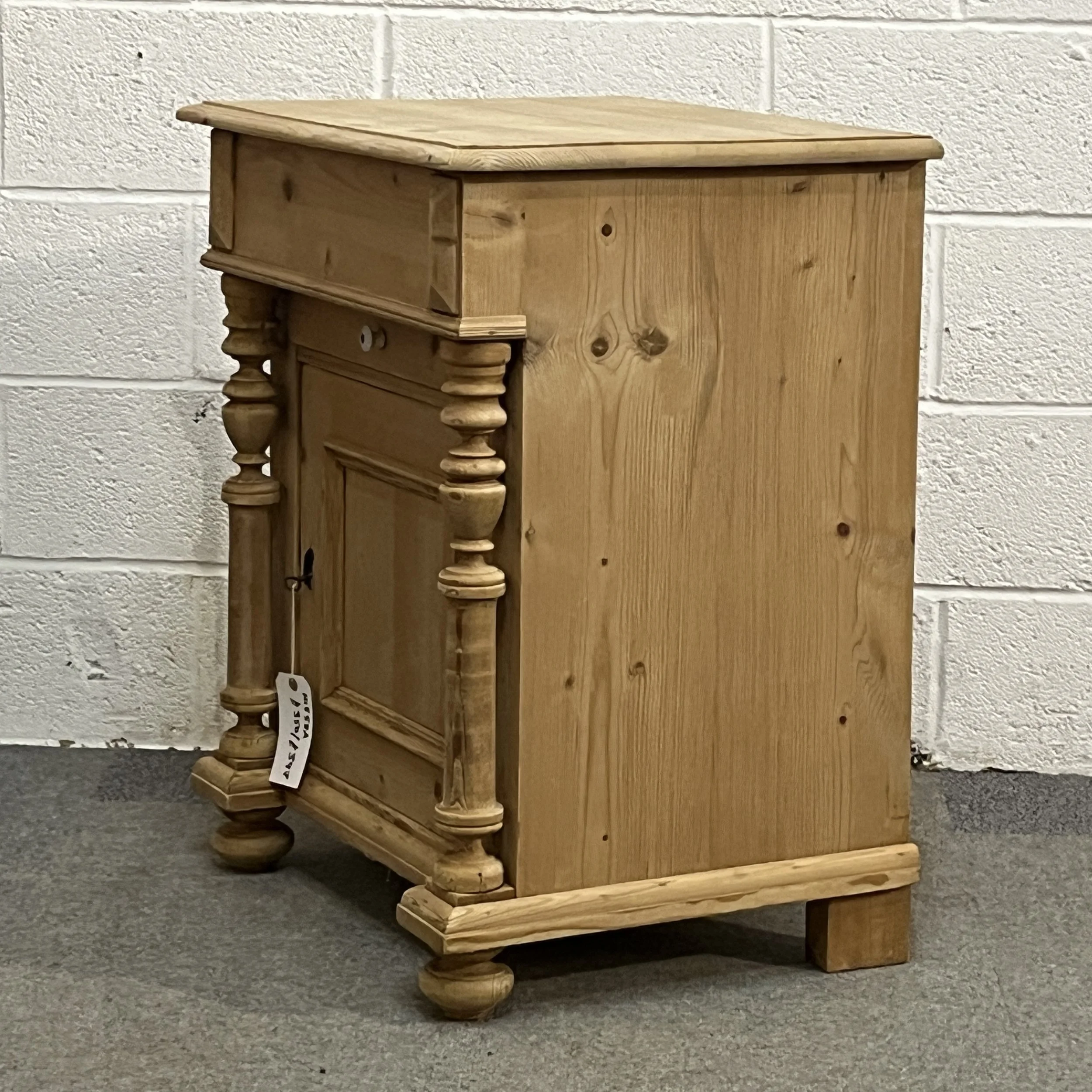 Right three-quarter view of the small antique pine wash cupboard