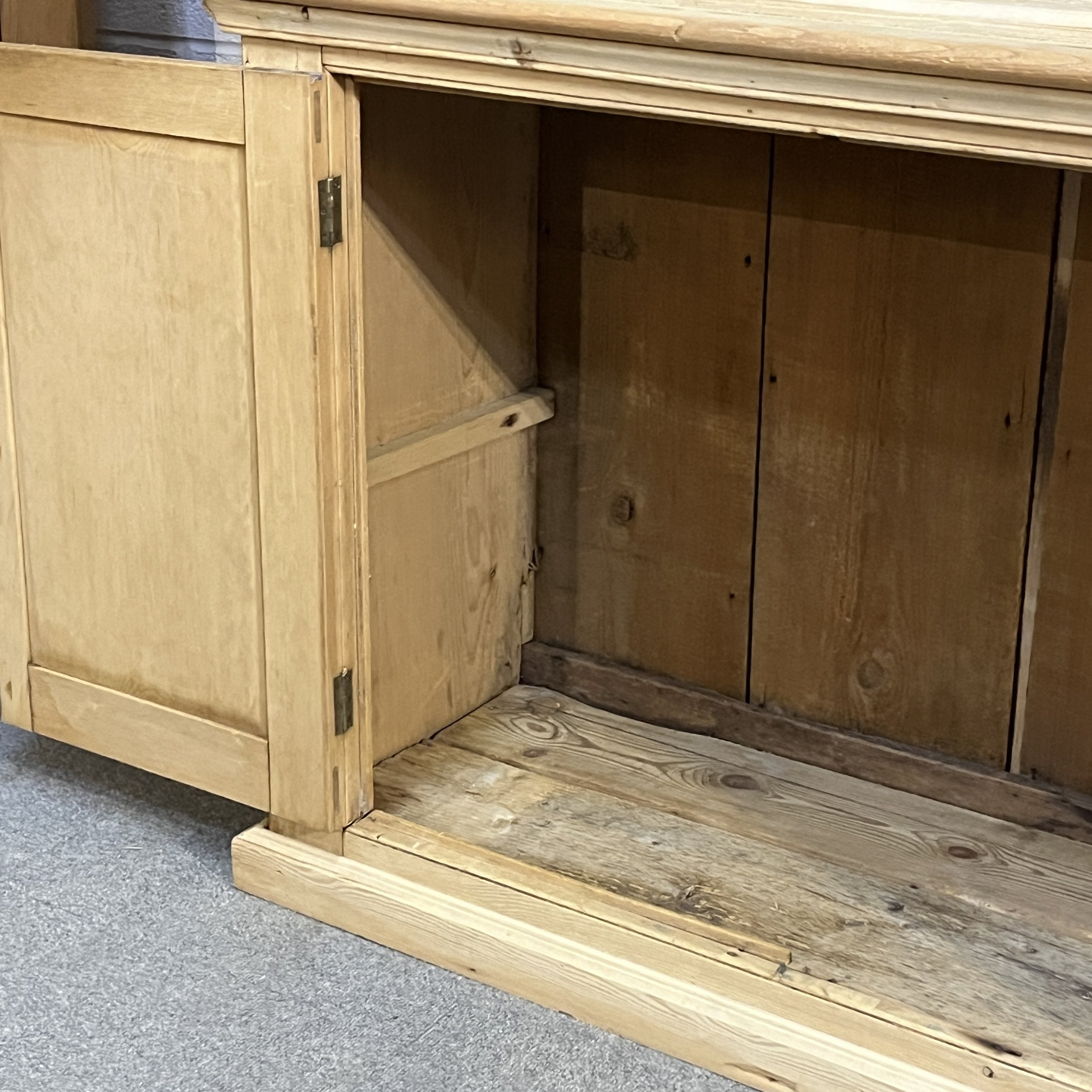 Large old pine cupboard N7809E lower cupboard interior, shelf support and panelled door