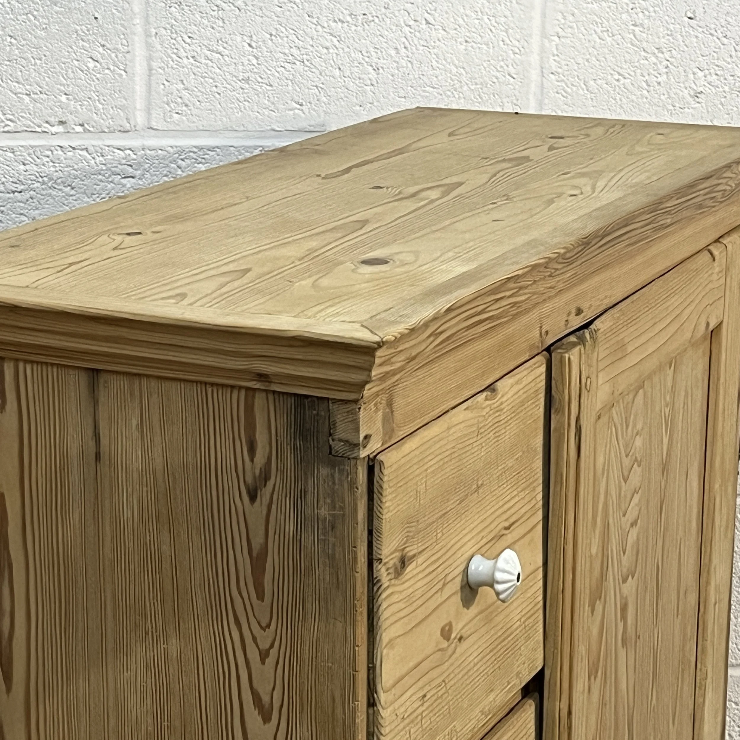 Close view of pine cupboard N7408C top, cornice, grain and worn edge