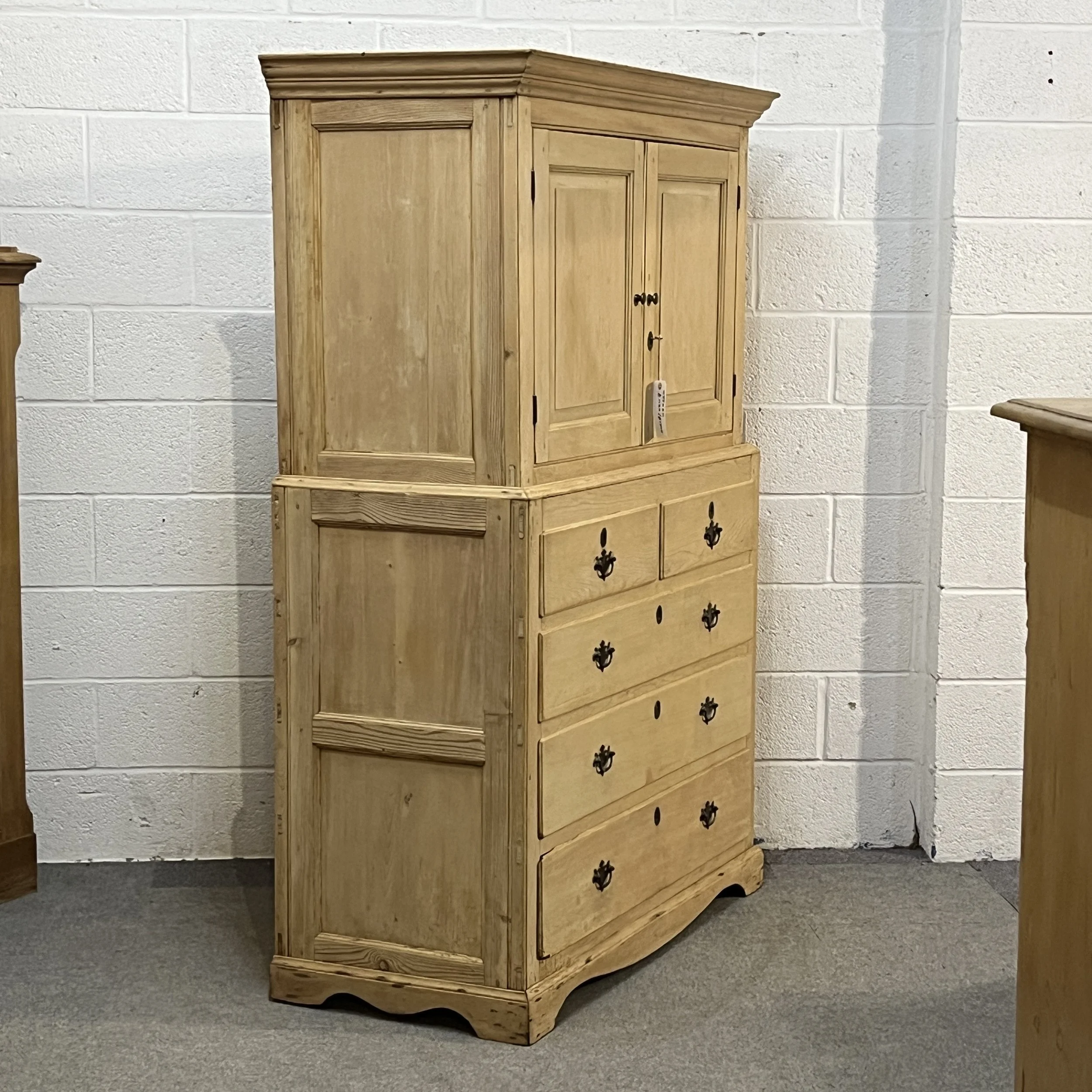 Left-side angle of pine linen press N3508H showing panelled side