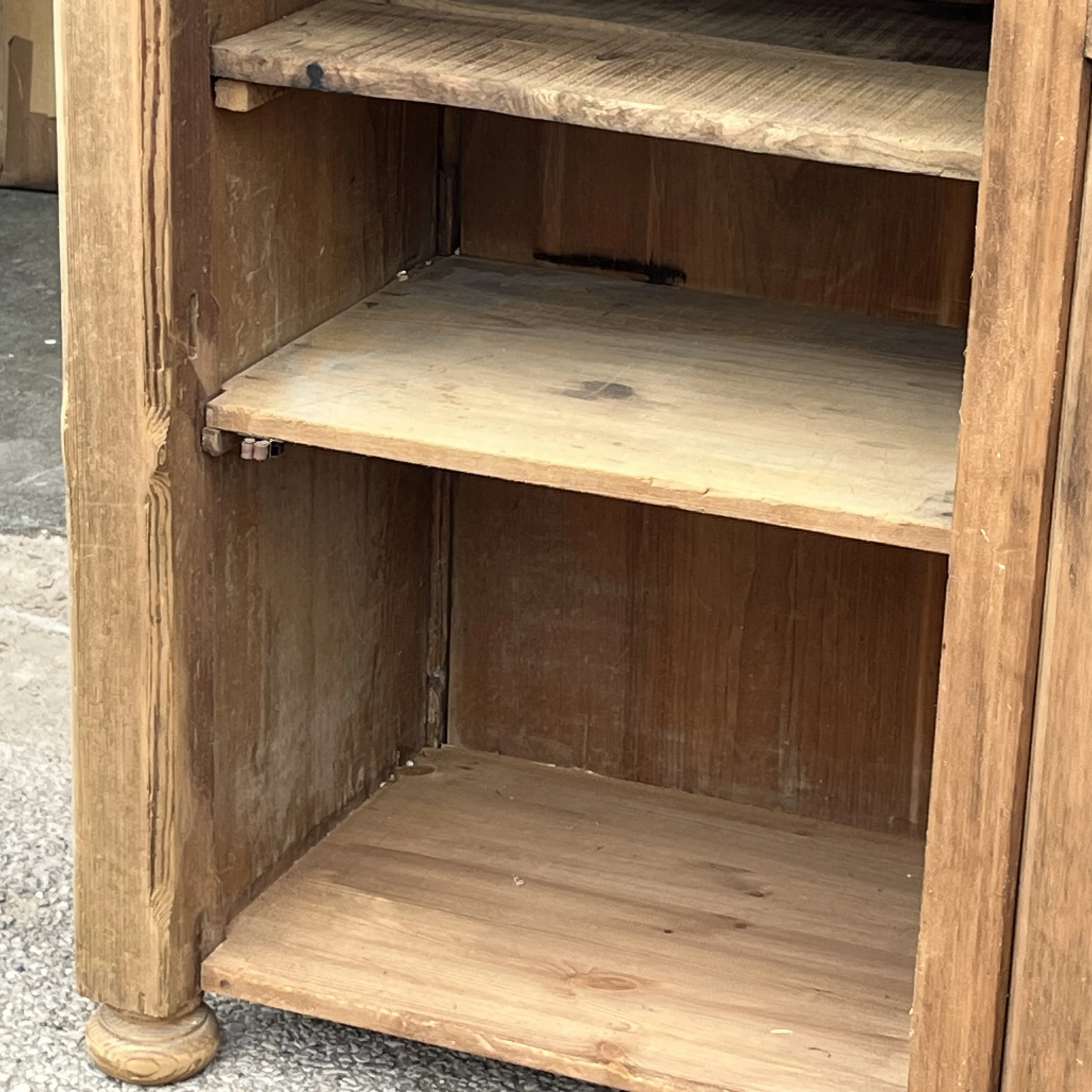 Close view of the shelves and interior timber of pine cupboard N8802C