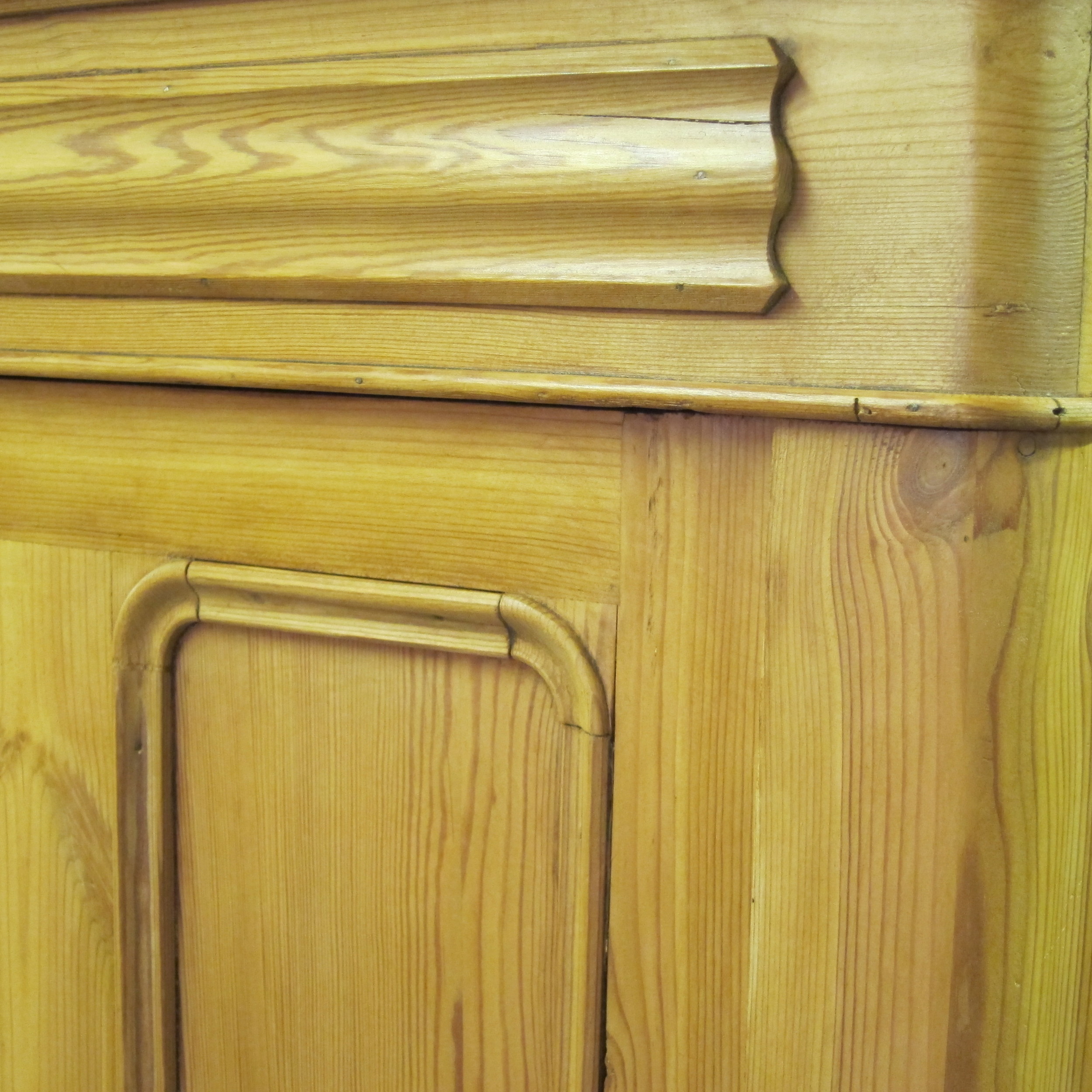 Close up waxed old pine cupboard