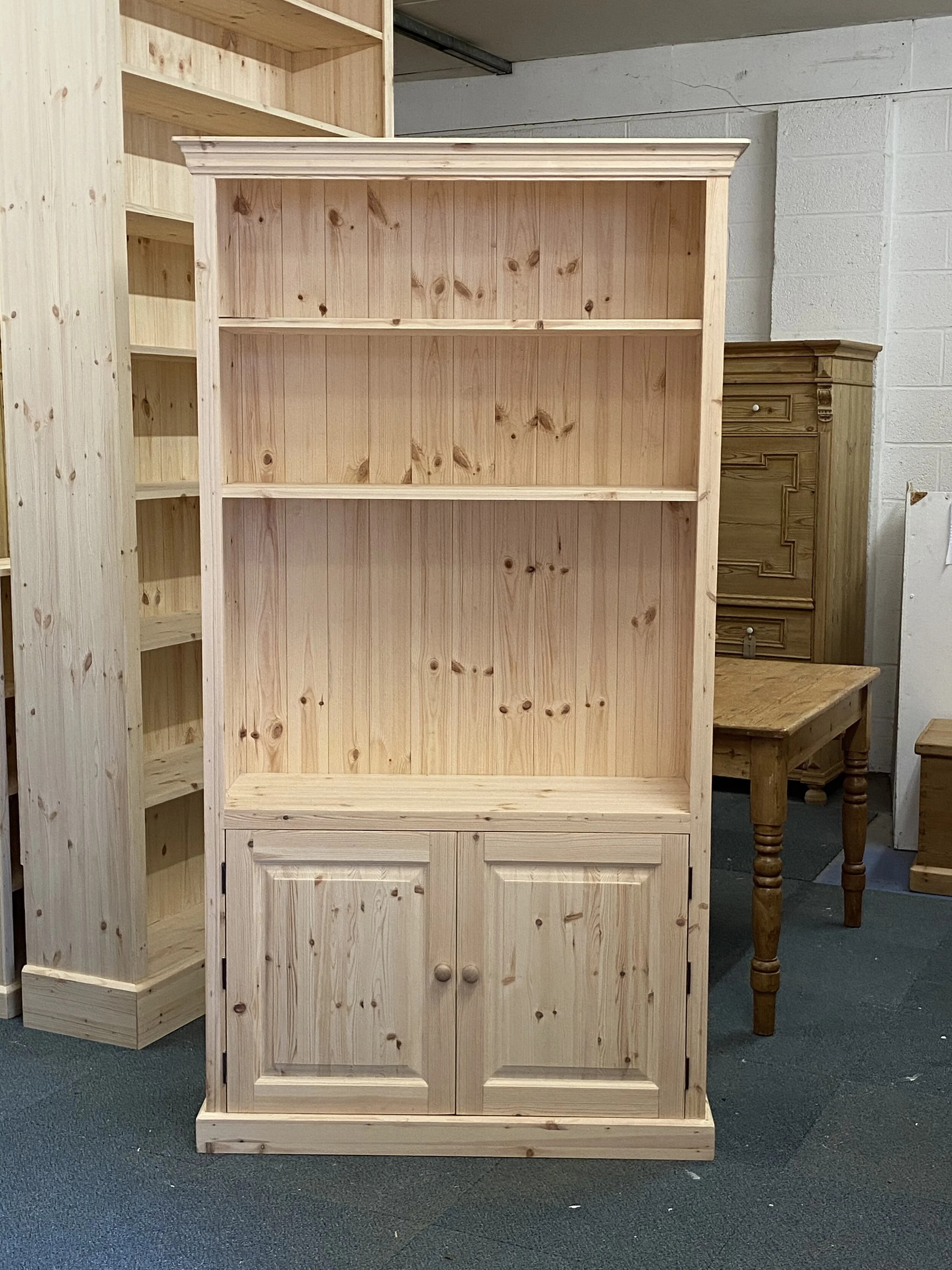 Tall pine tv cupboard in bare wood