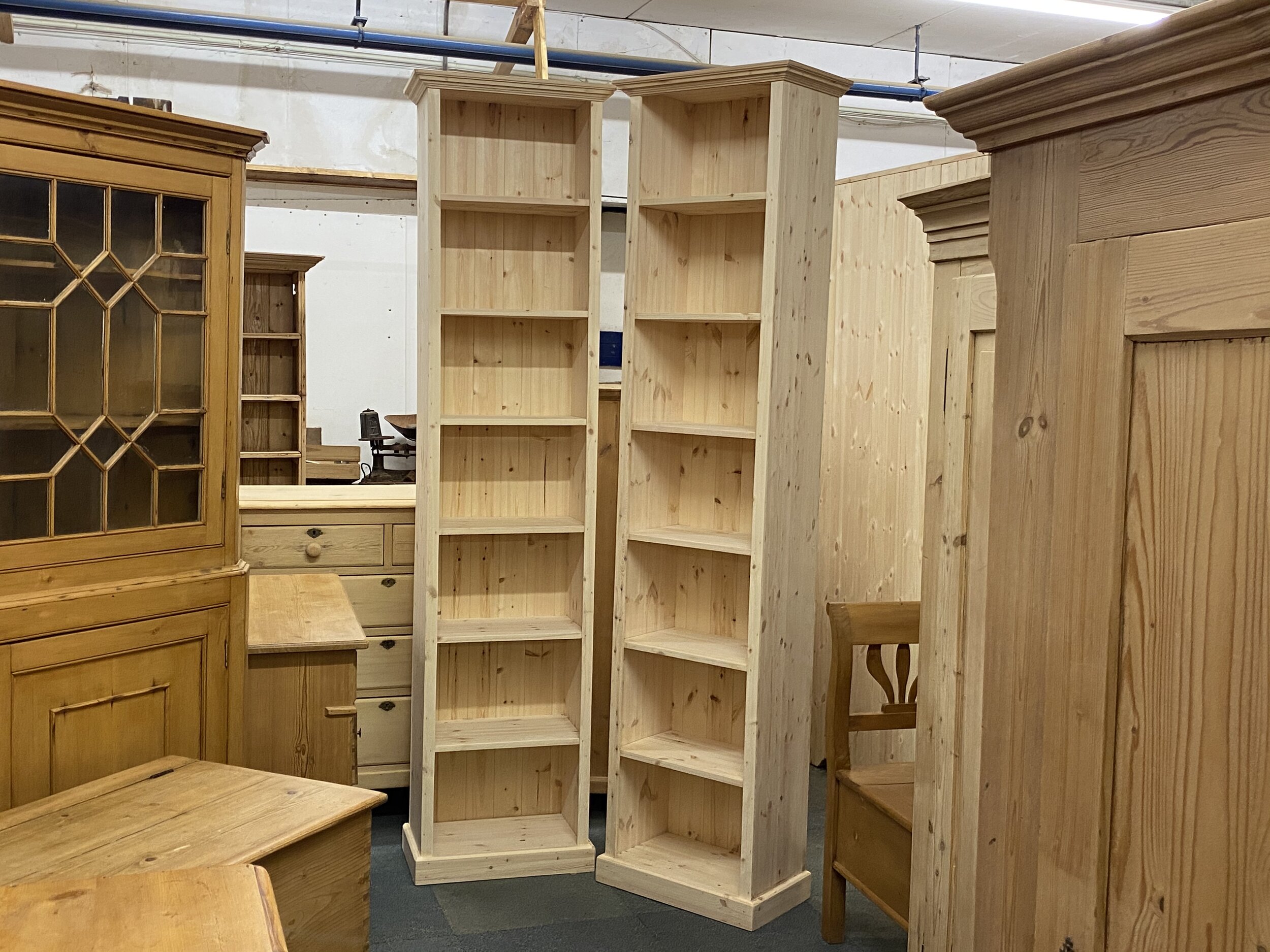 Pair of tall slim pine bookcases