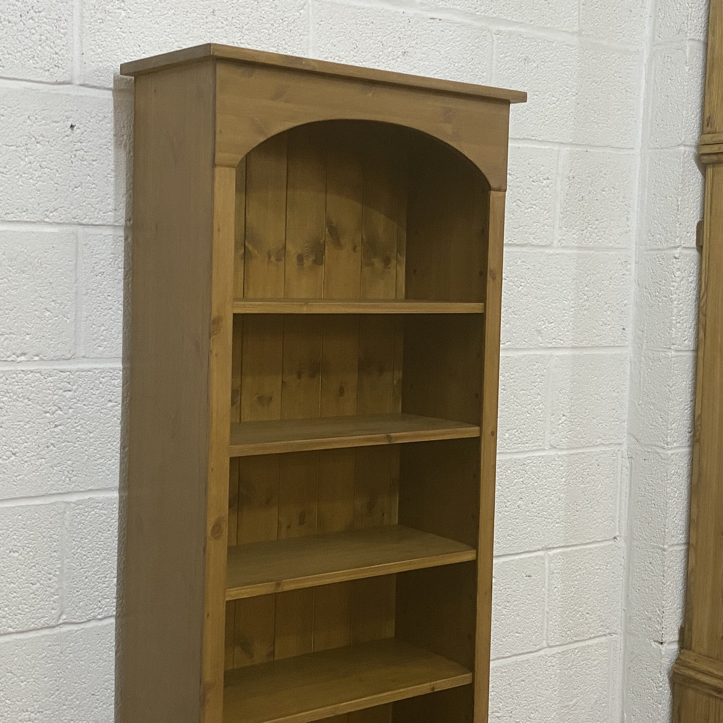 Arched top pine bookcase
