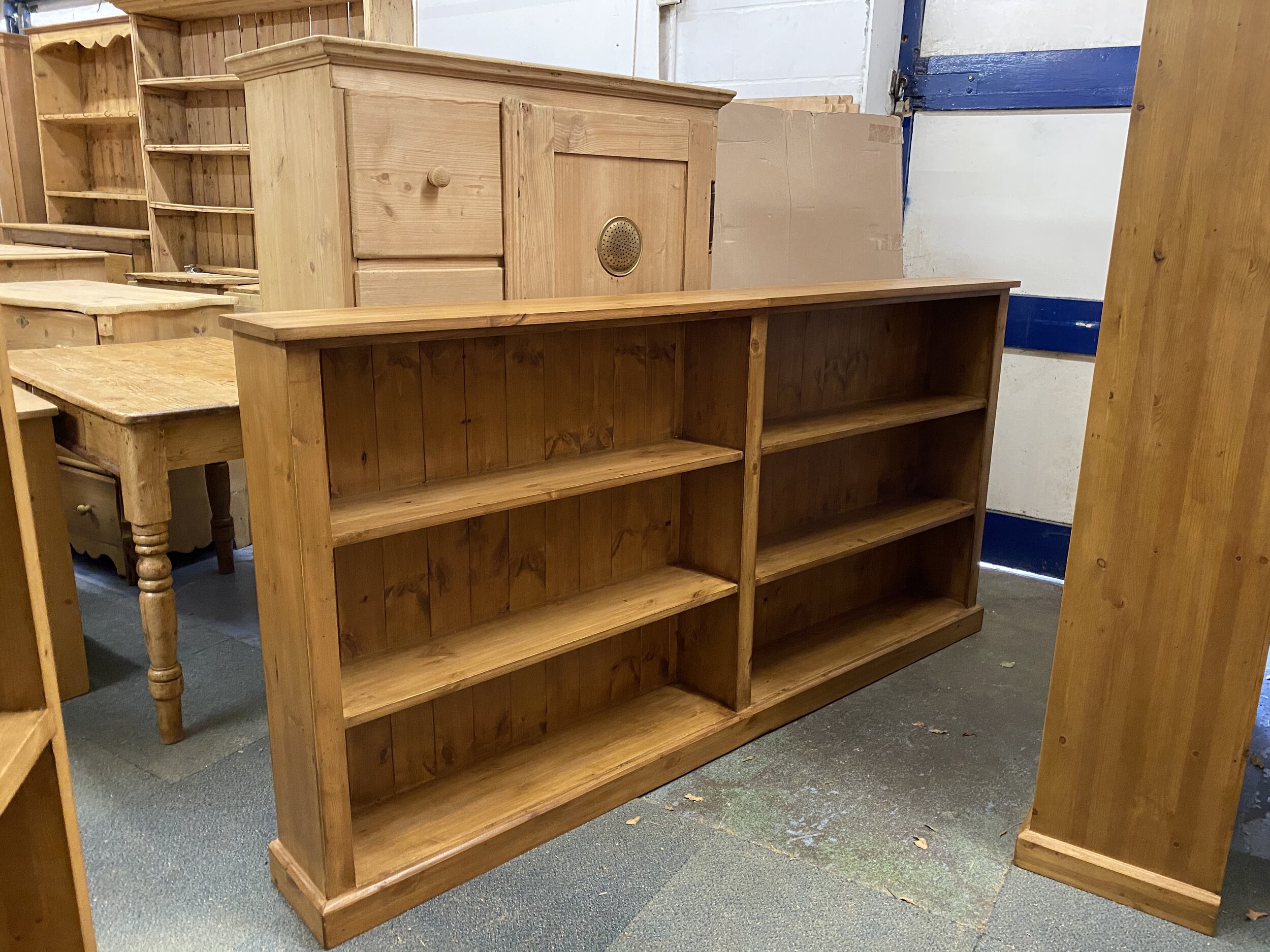 Low wide pine bookcase