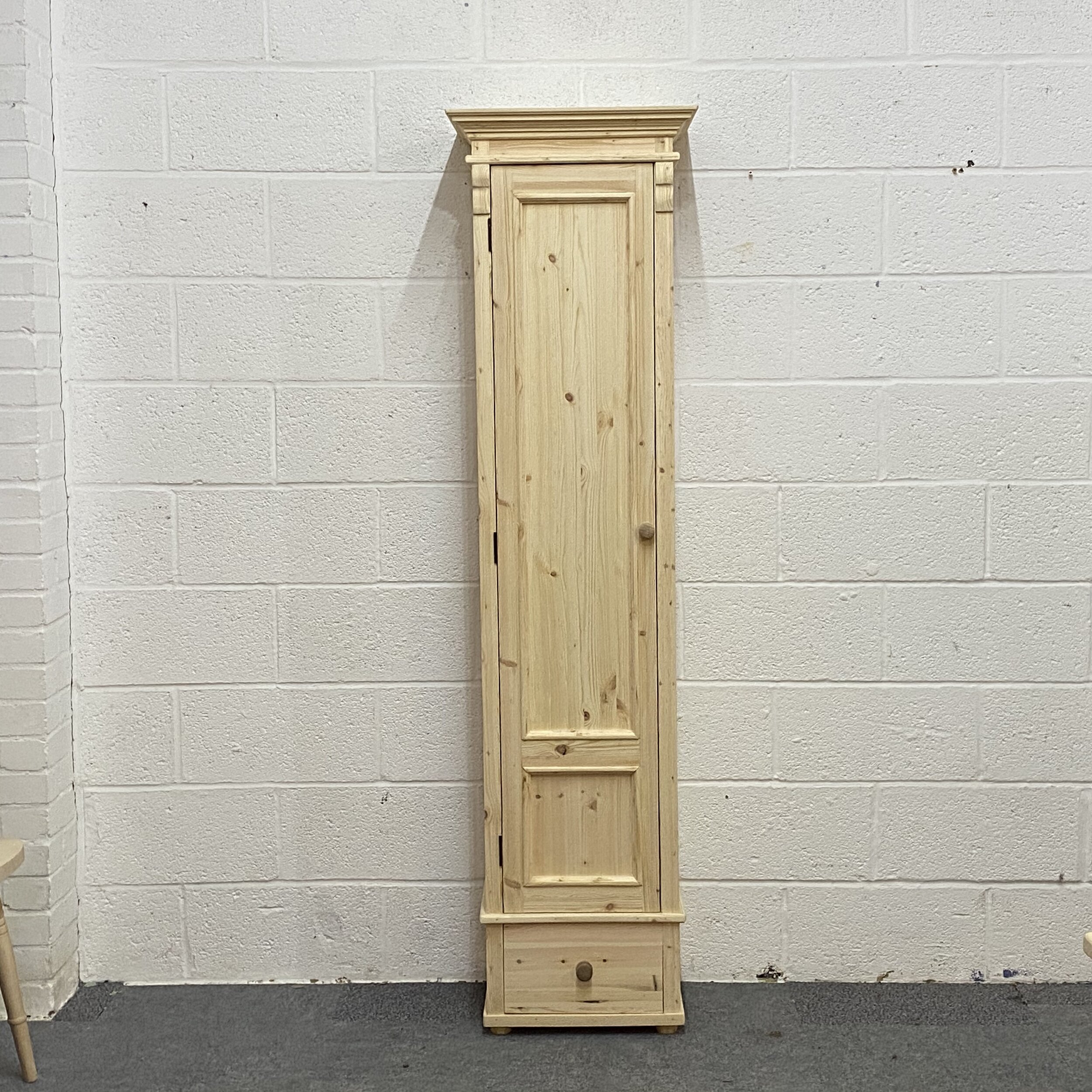 Tall slim pine cupboard made from new pine