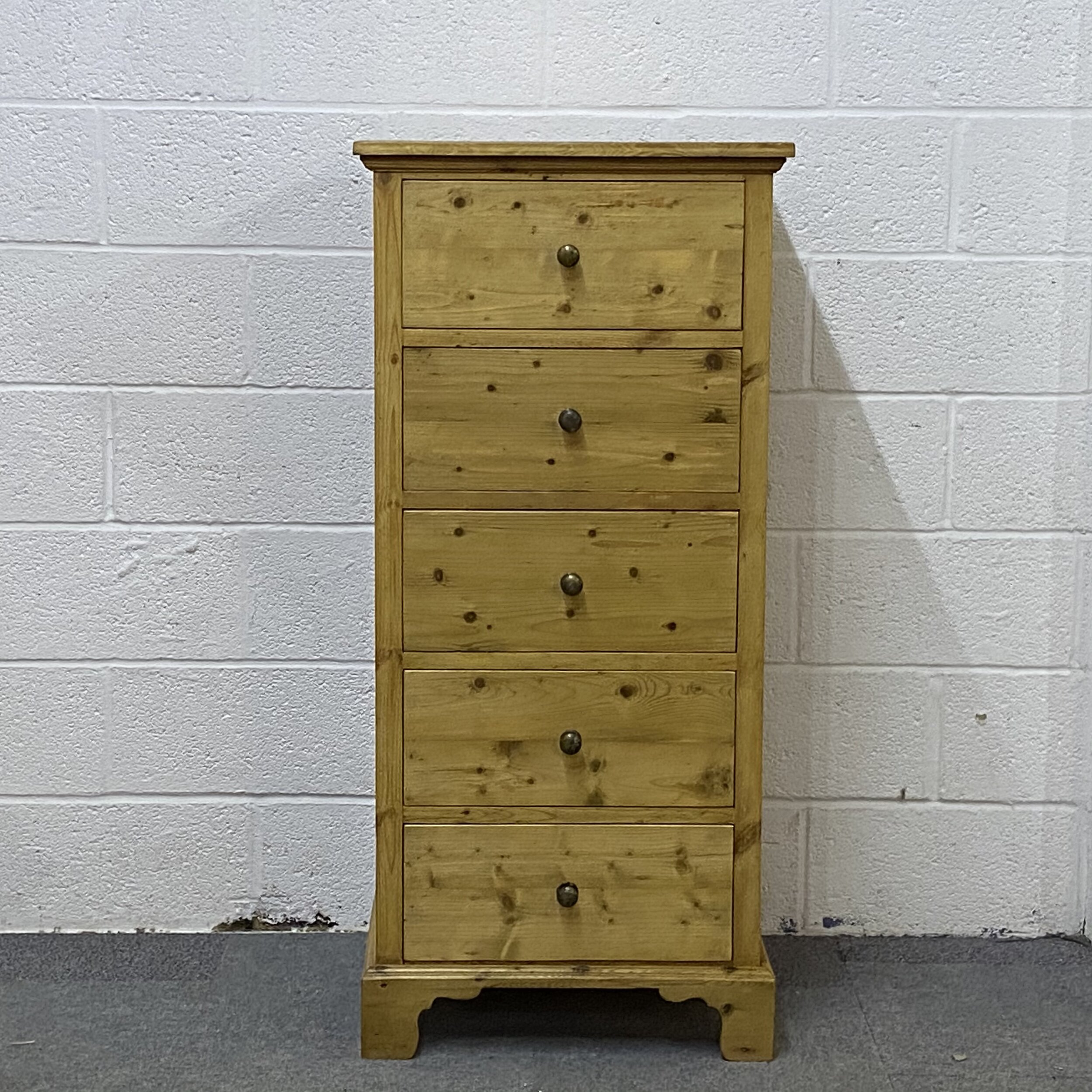 Tall slim pine chest of drawers