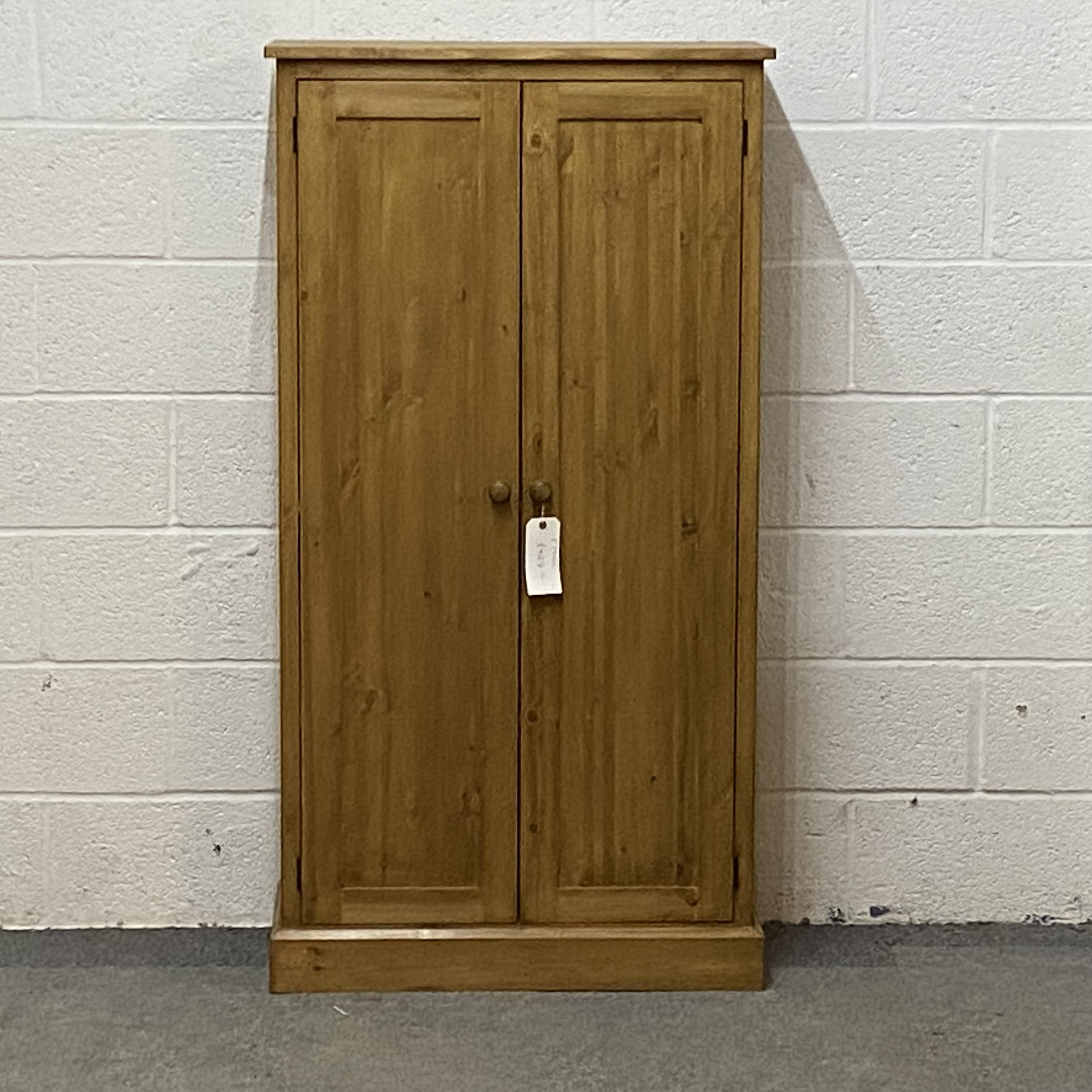 Tall slim pine cupboard