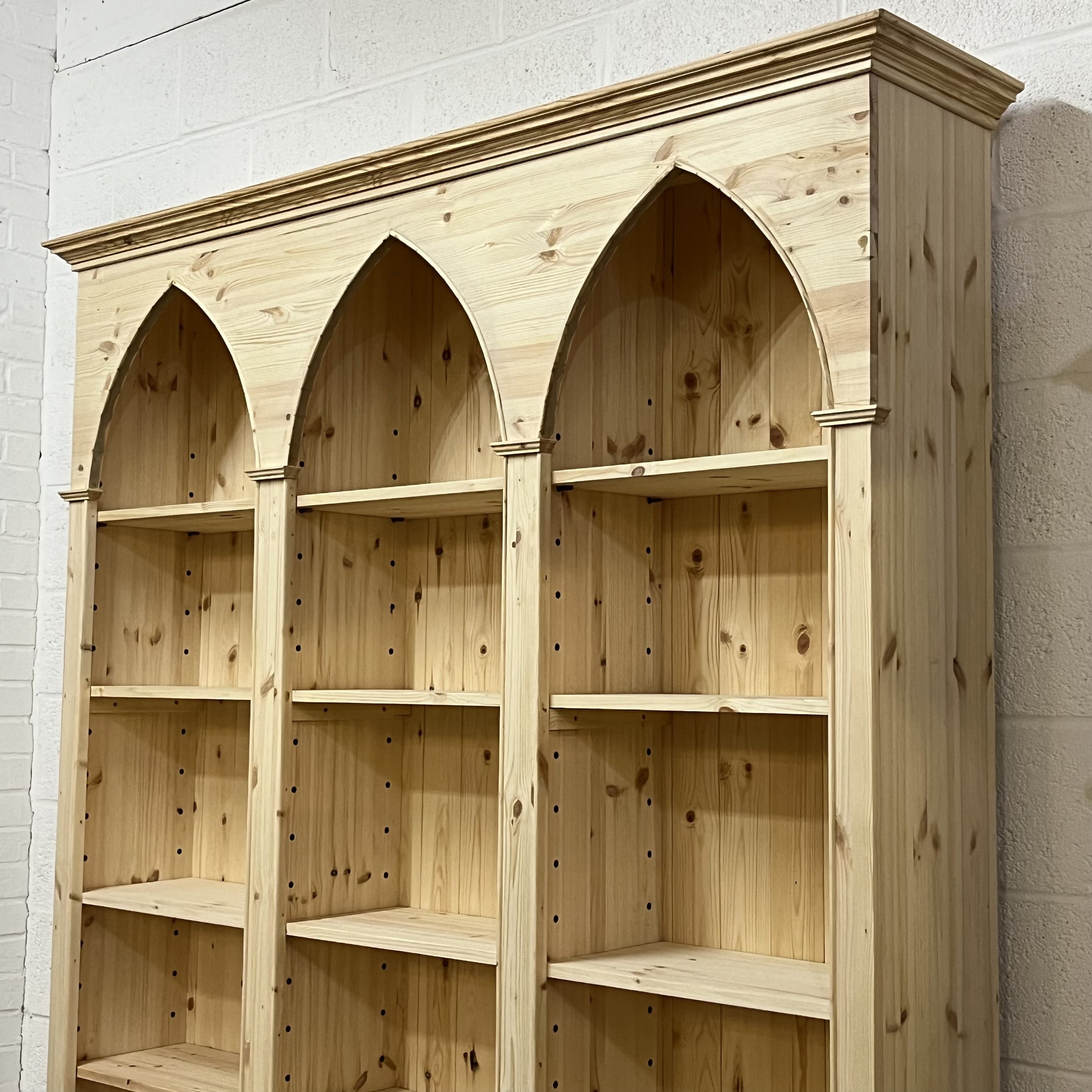 Arched pine bookcase