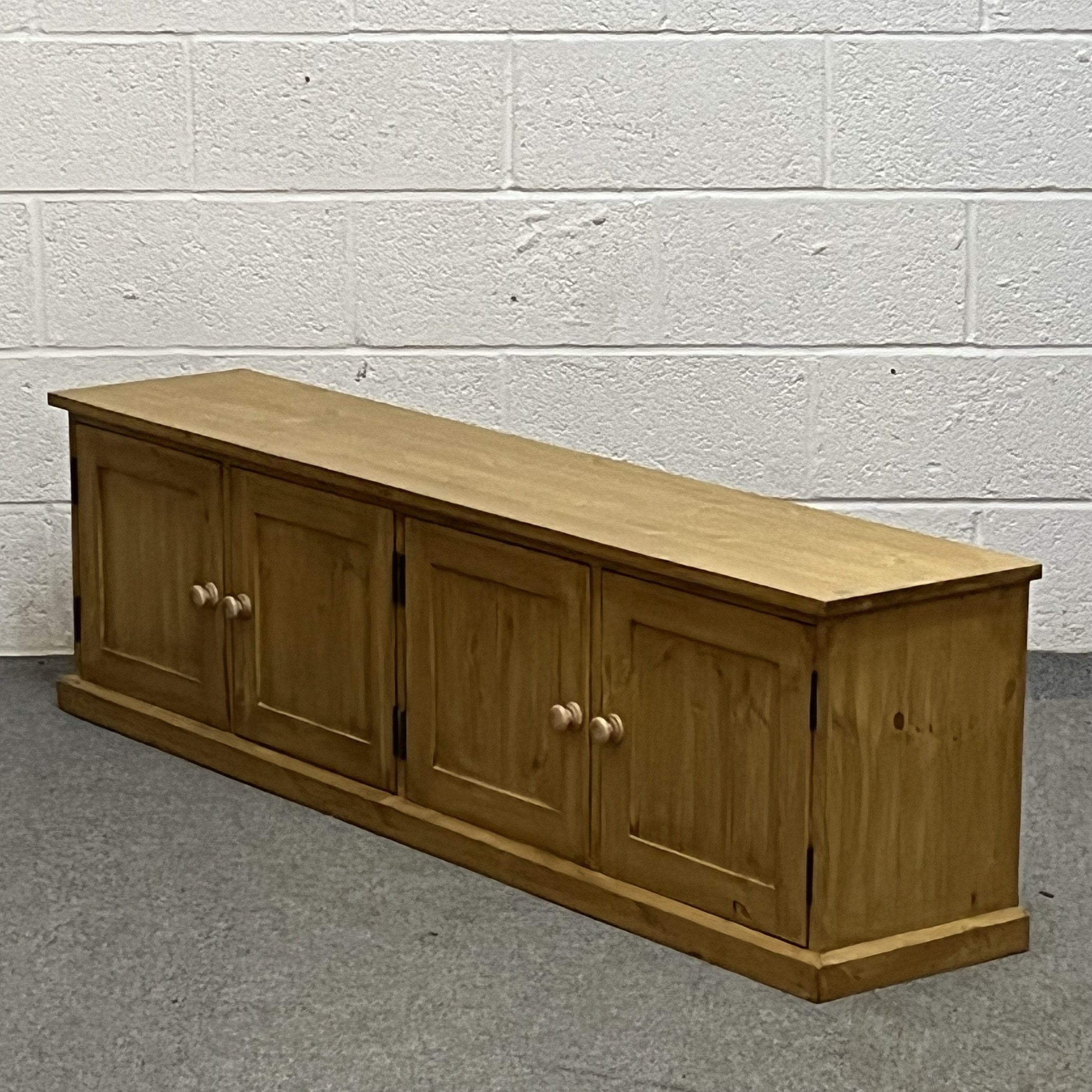 Low, wide pine shoe bench