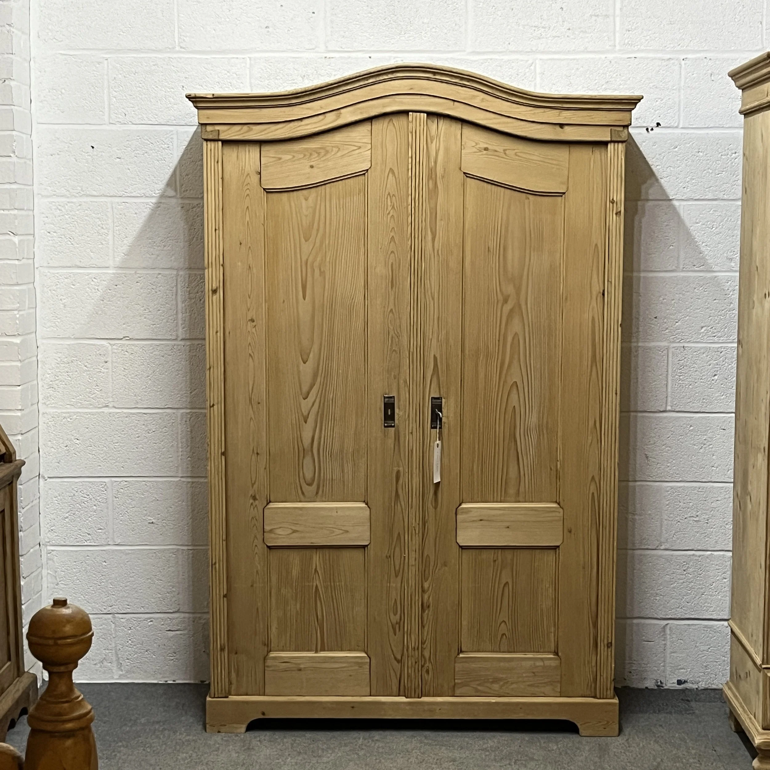 Large shelved antique pine cupboard arched top