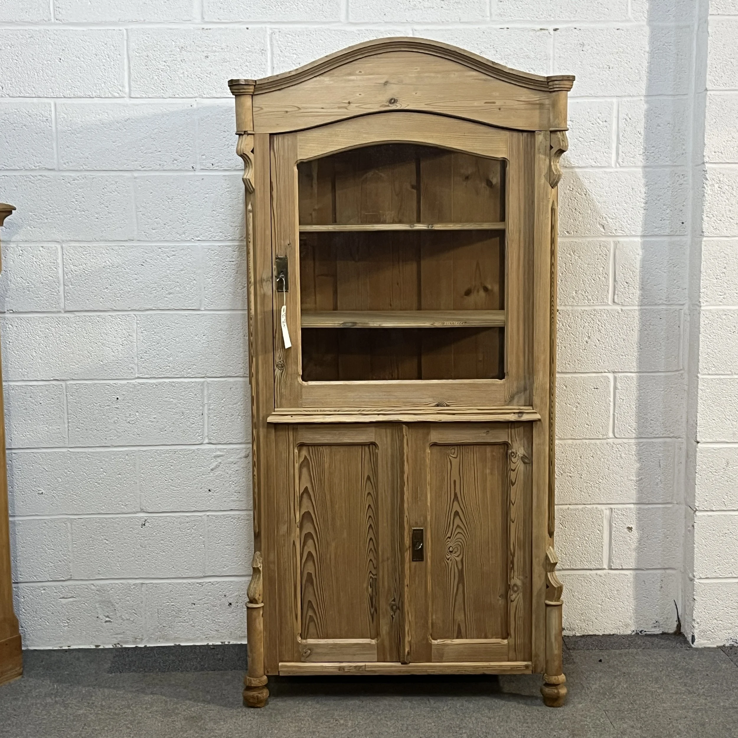Full front view of arched-top antique pine partly glazed display cabinet N3404D