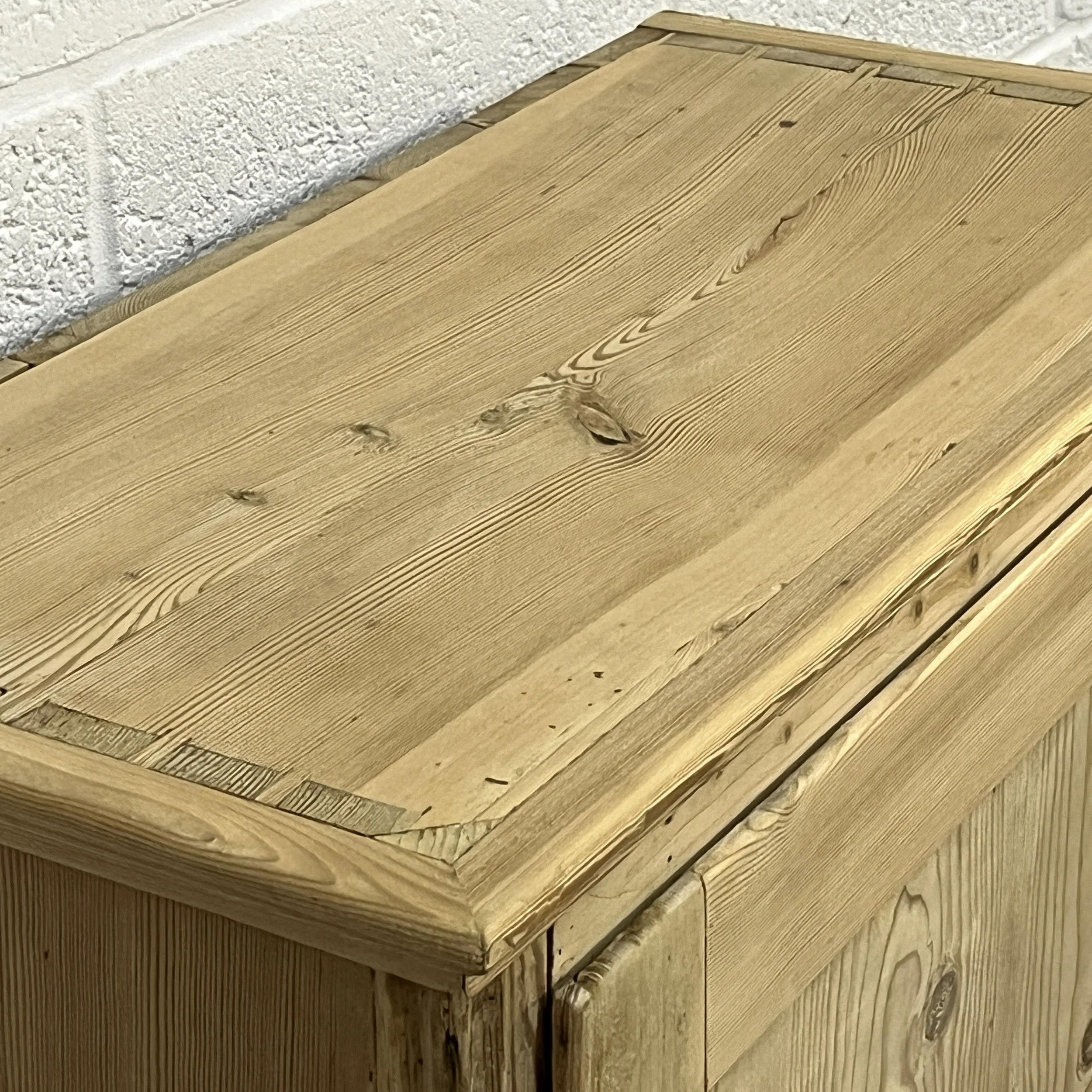 Top surface and moulded edge of pine larder cupboard N3207C