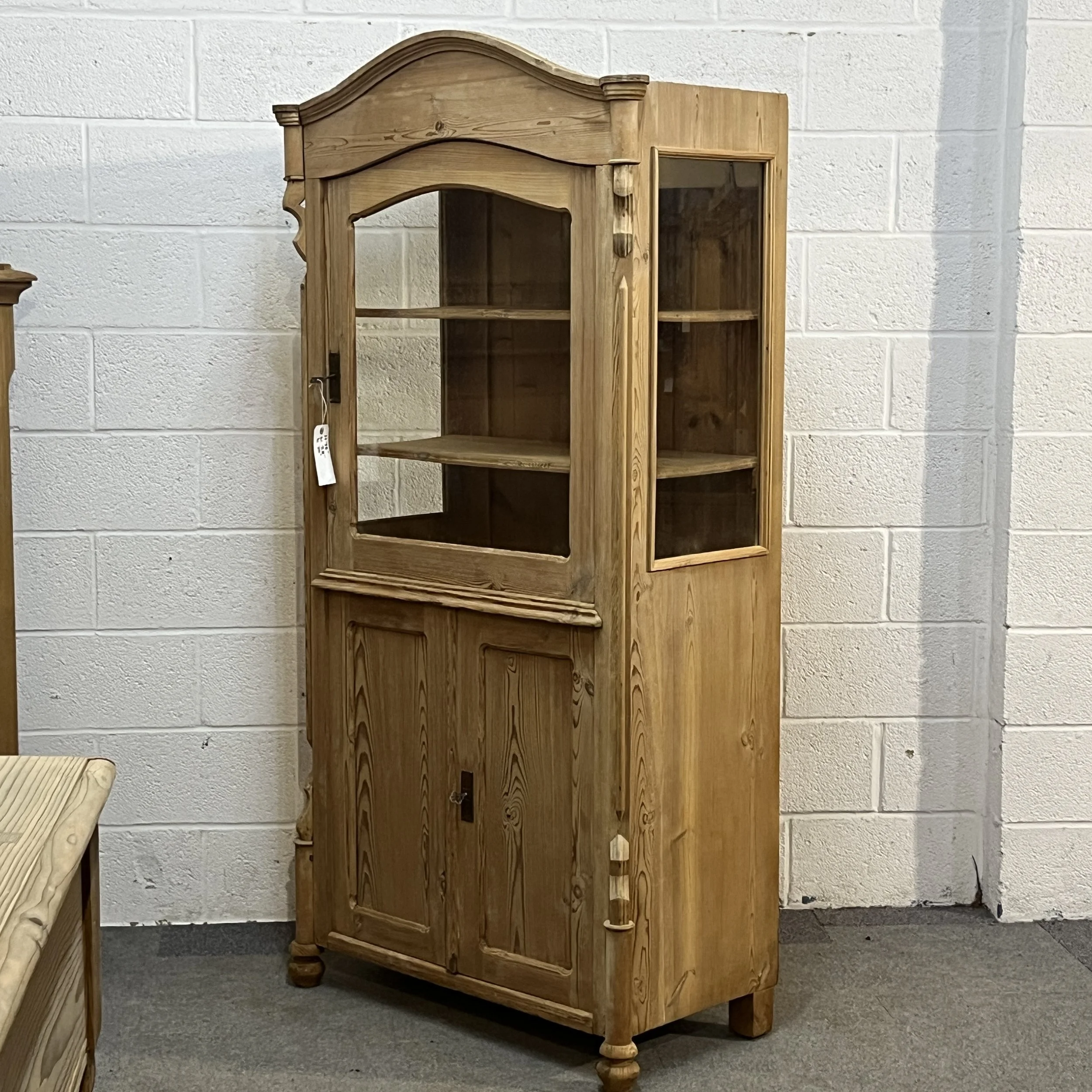 Right angled full view of antique pine cabinet N3404D with glazed side panel