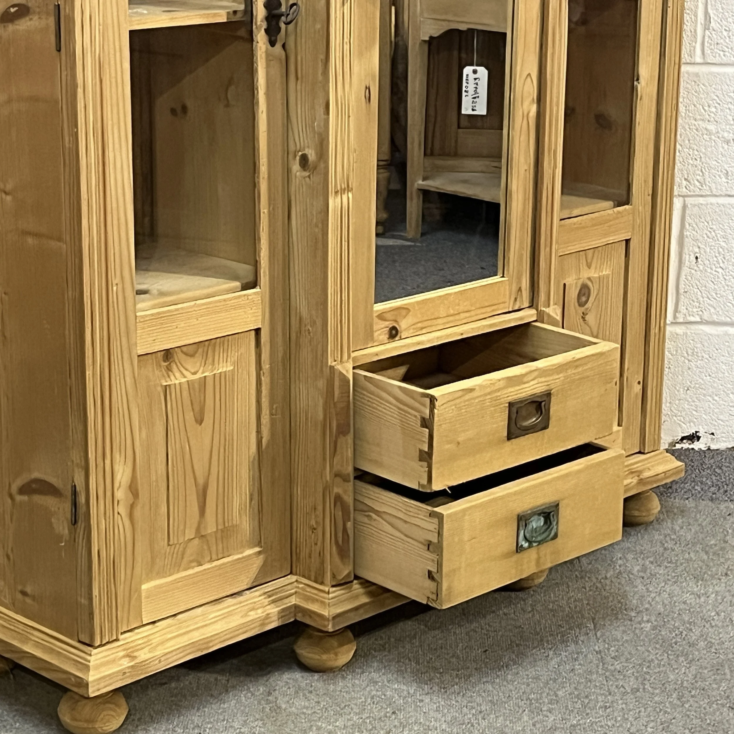 Open central drawers showing dovetail joints and aged metal handles on pine cabinet N7500D