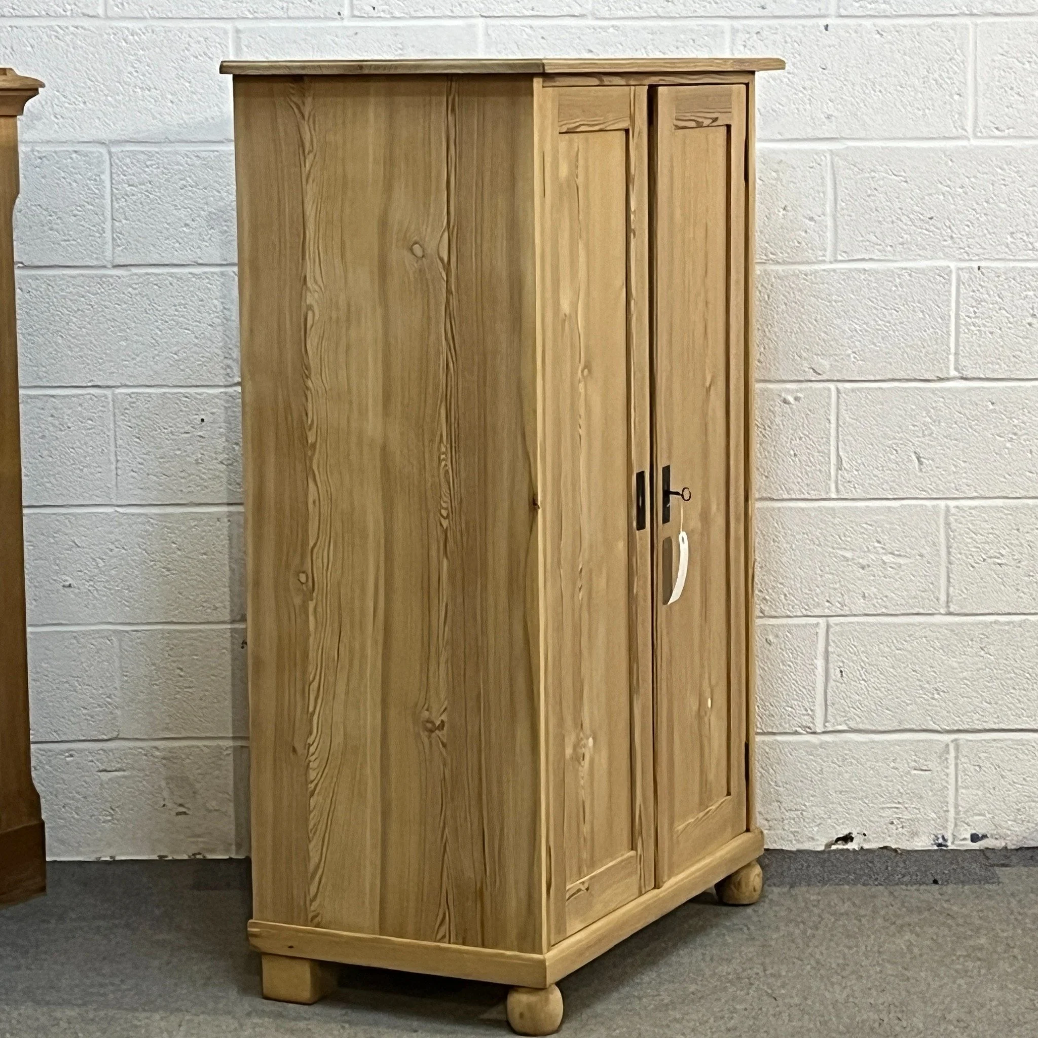 N7600D pine cupboard — angled front and left side view