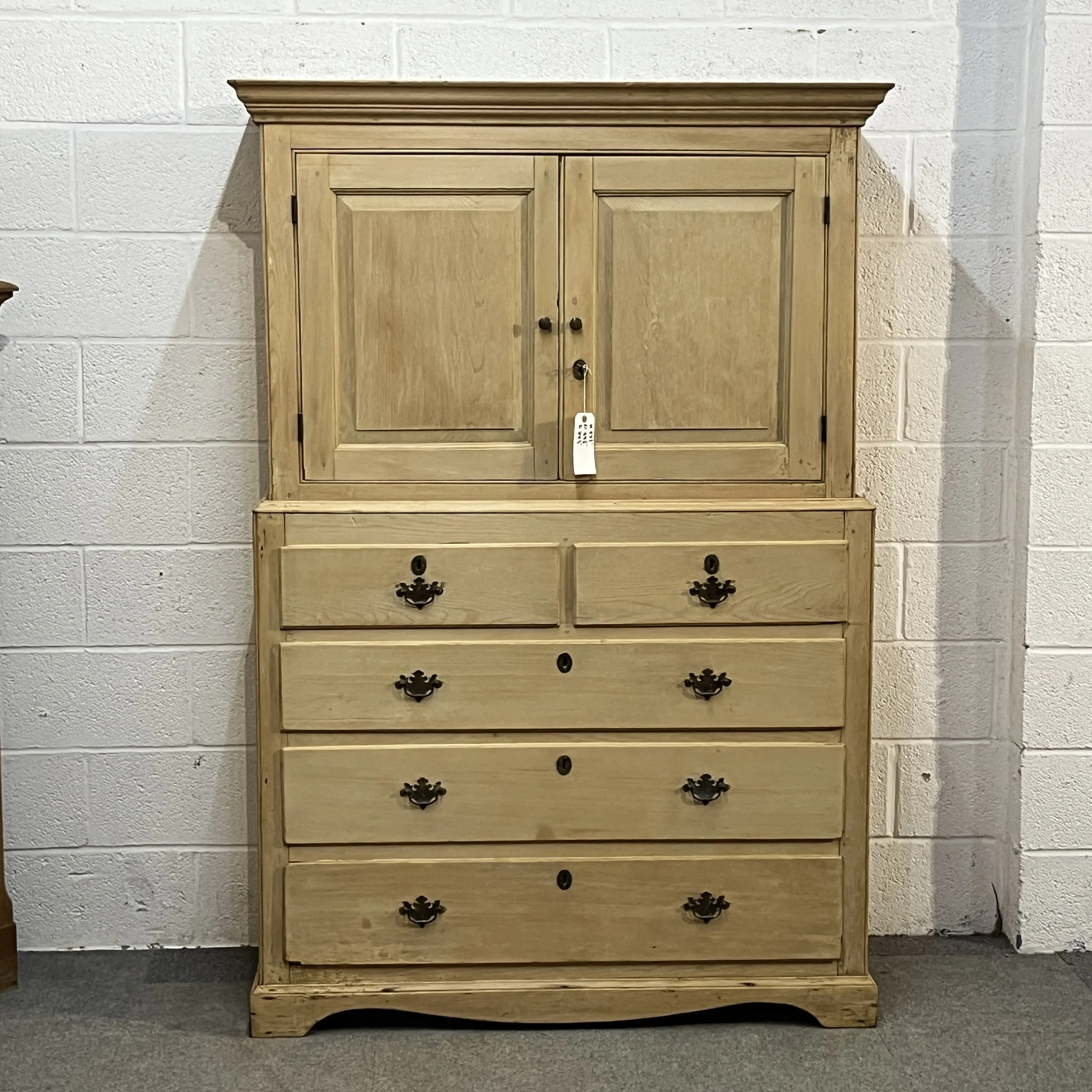Front view of early Victorian pine linen press N3508H with upper cupboard and five drawers