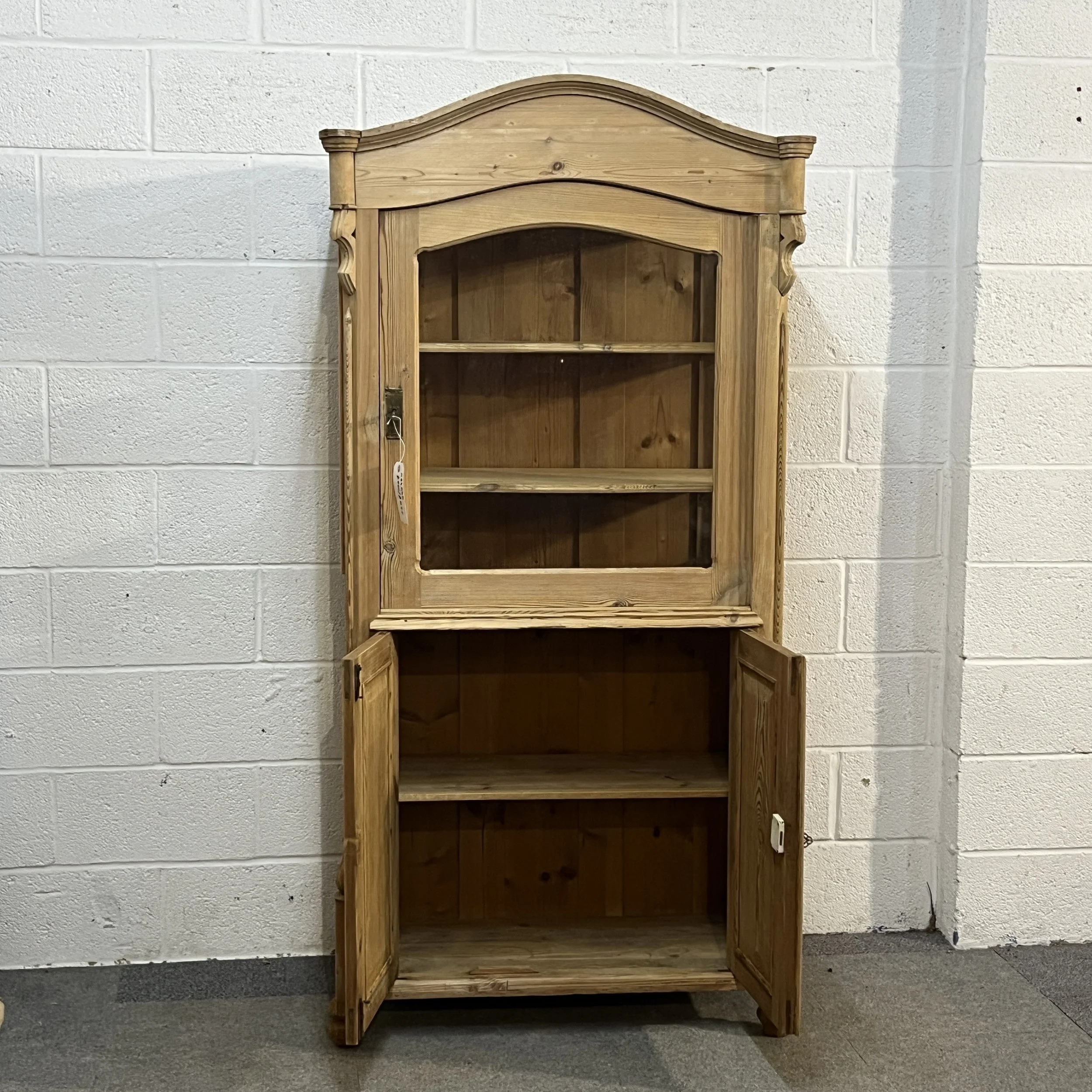 Front view of antique pine cabinet N3404D with both lower cupboard doors open