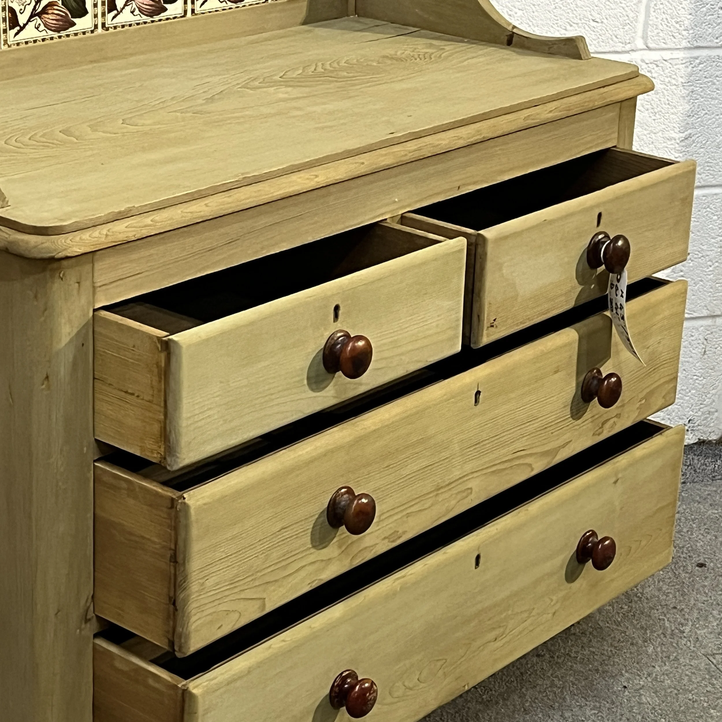 Open drawers showing the interiors of the Victorian pine chest of drawers