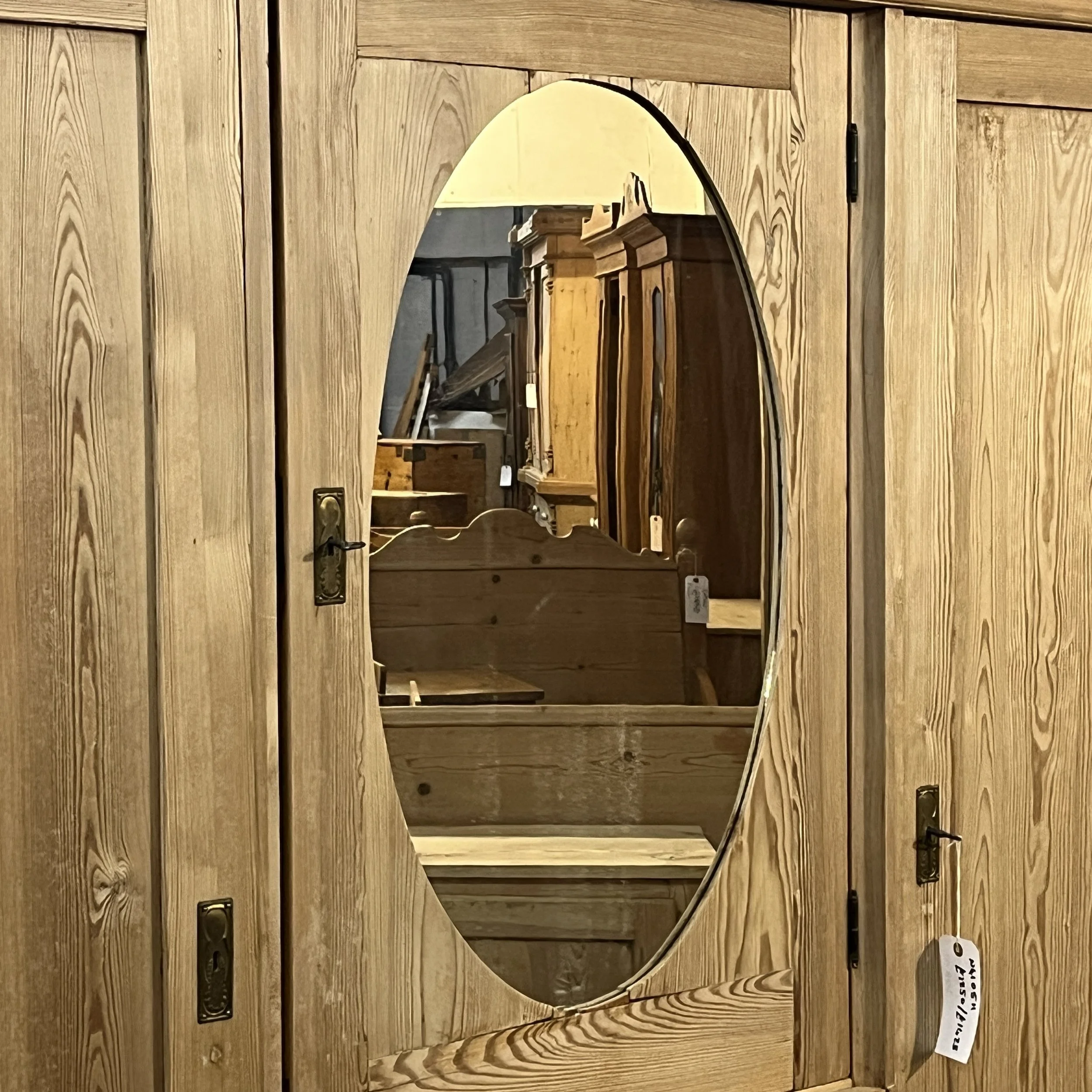 Close view of N4105H oval mirror, pine door and metal handle