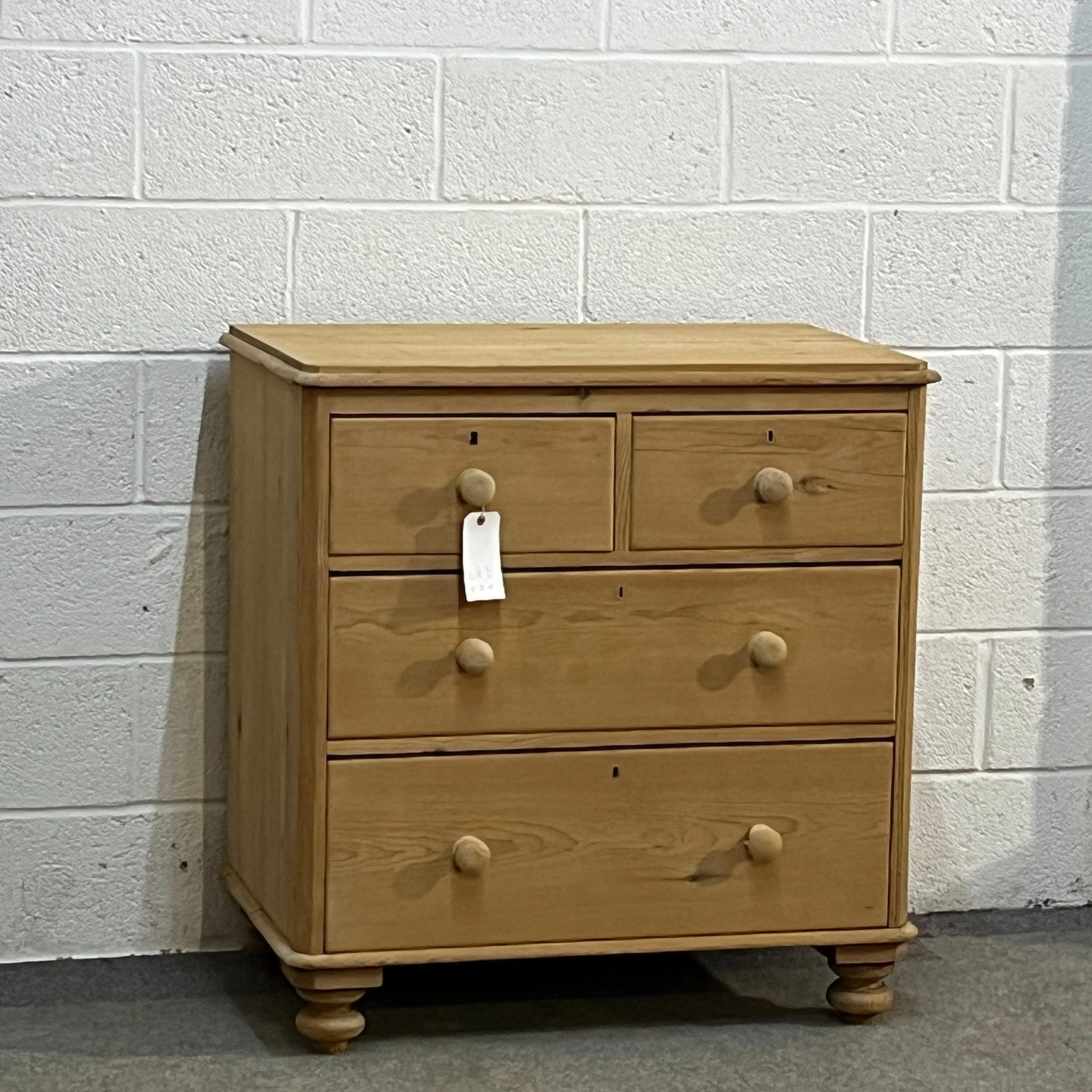 N8608C late Victorian pine chest, full front view with original feet and new wooden knobs