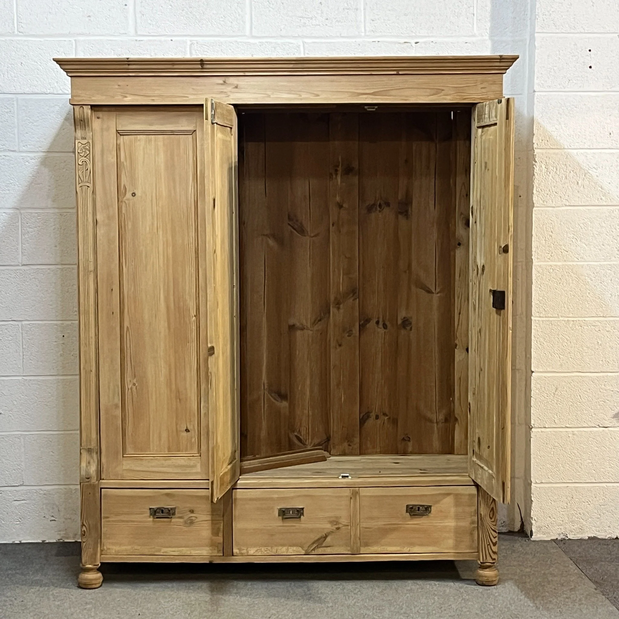N4700F wardrobe with double doors open showing wide hanging compartment