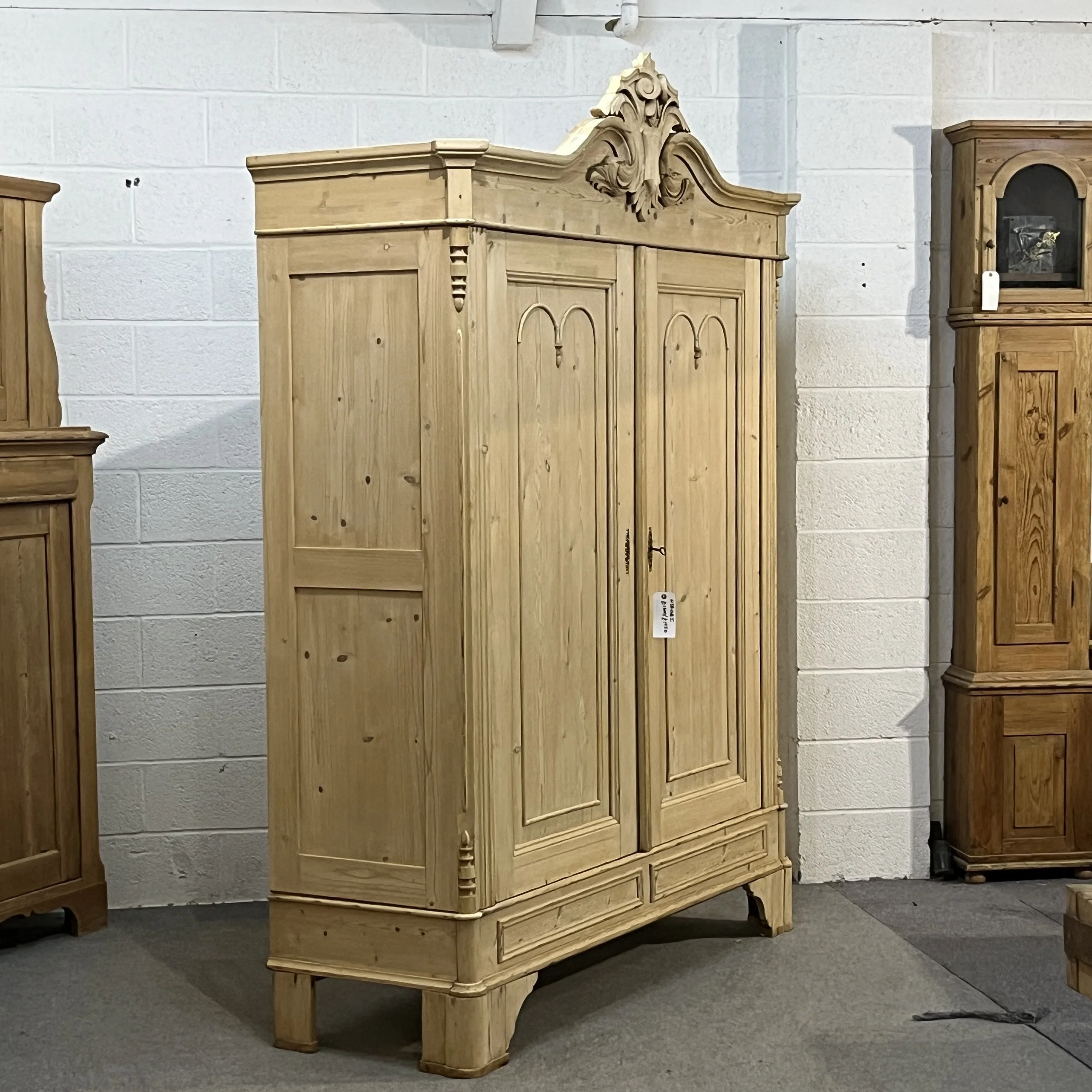 Opposite angled view of the pine wardrobe with panelled double doors