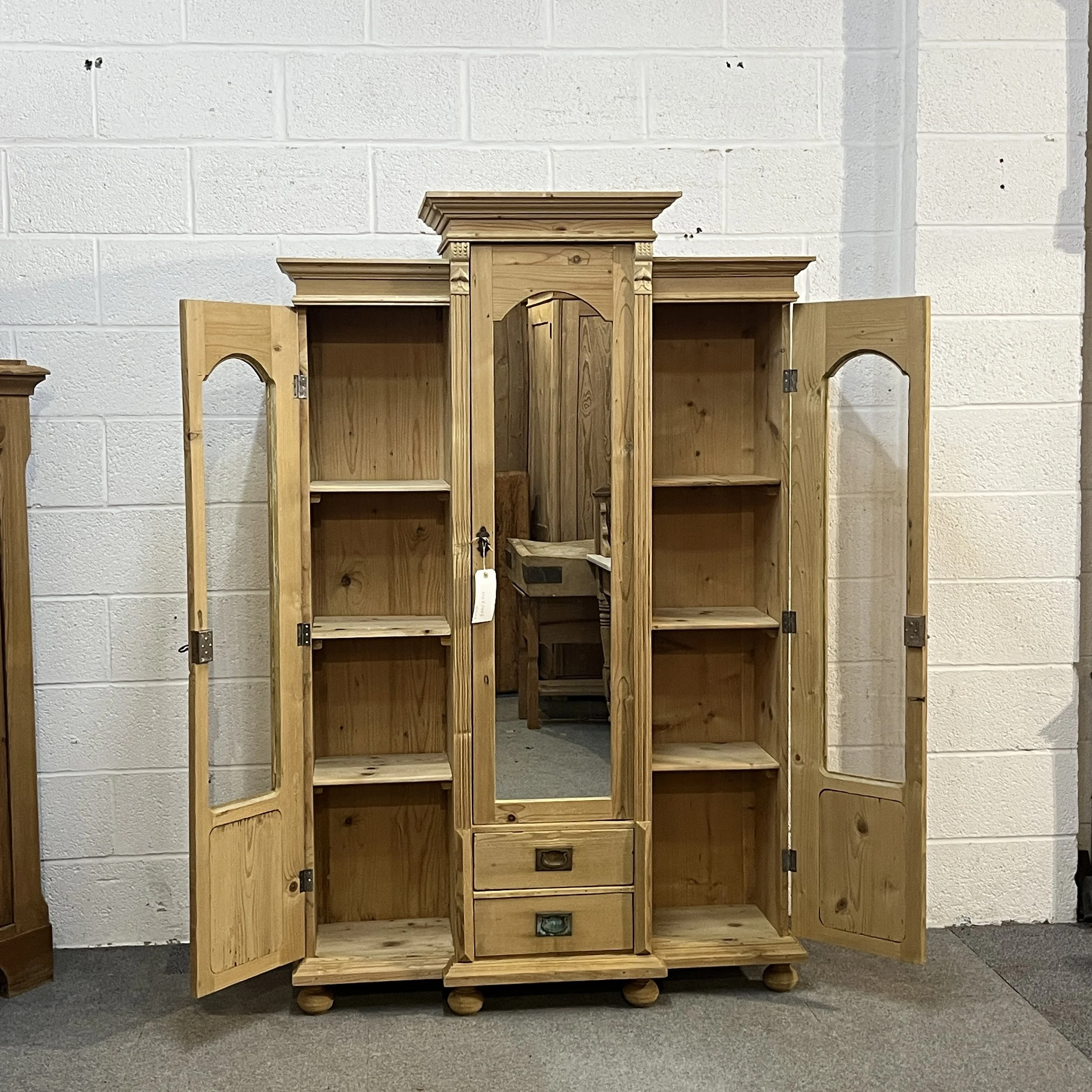 Pine display cabinet N7500D with both glazed side doors fully open, showing three shelves each side
