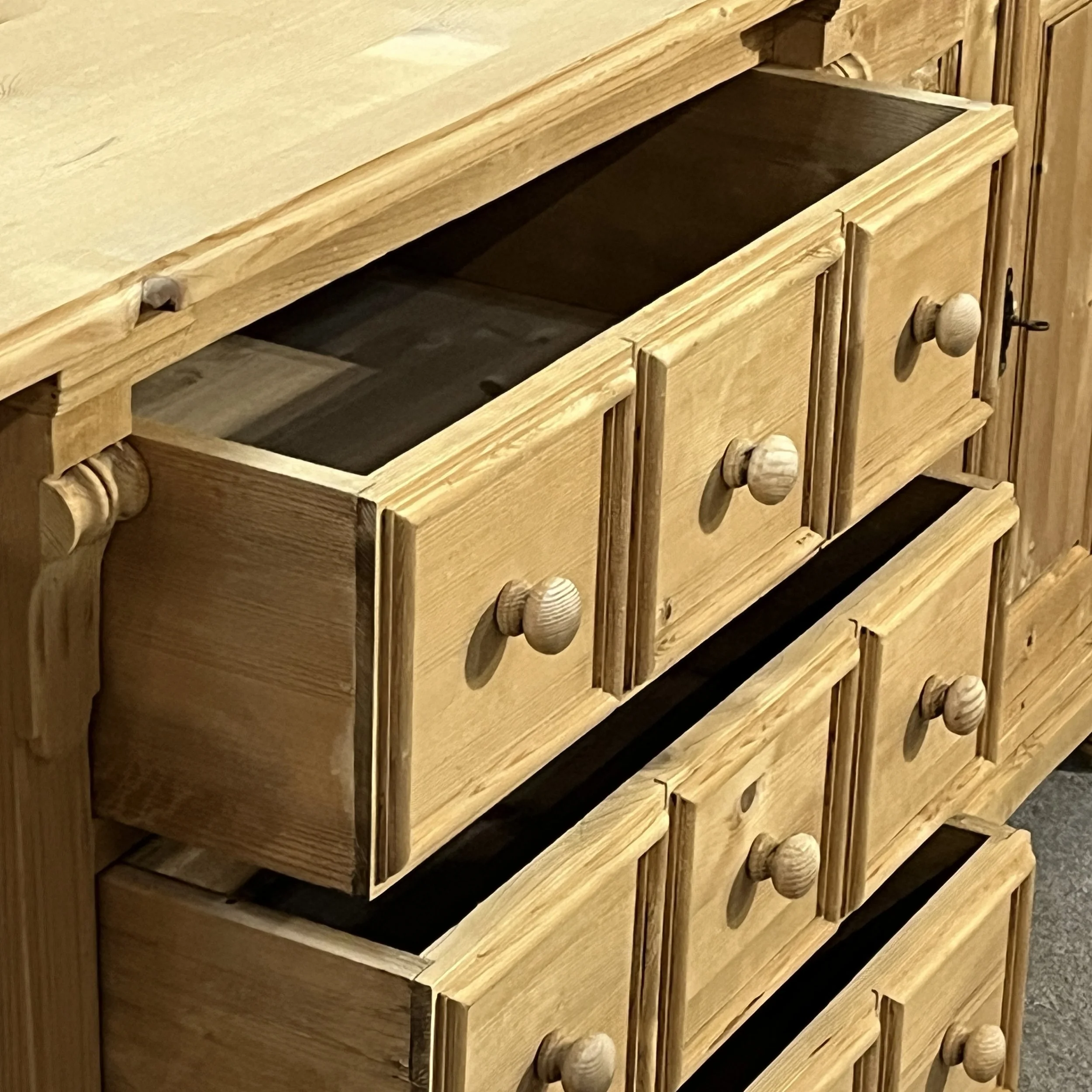 Pine sideboard N7102E with upper central drawers open, showing their full width and wooden interiors