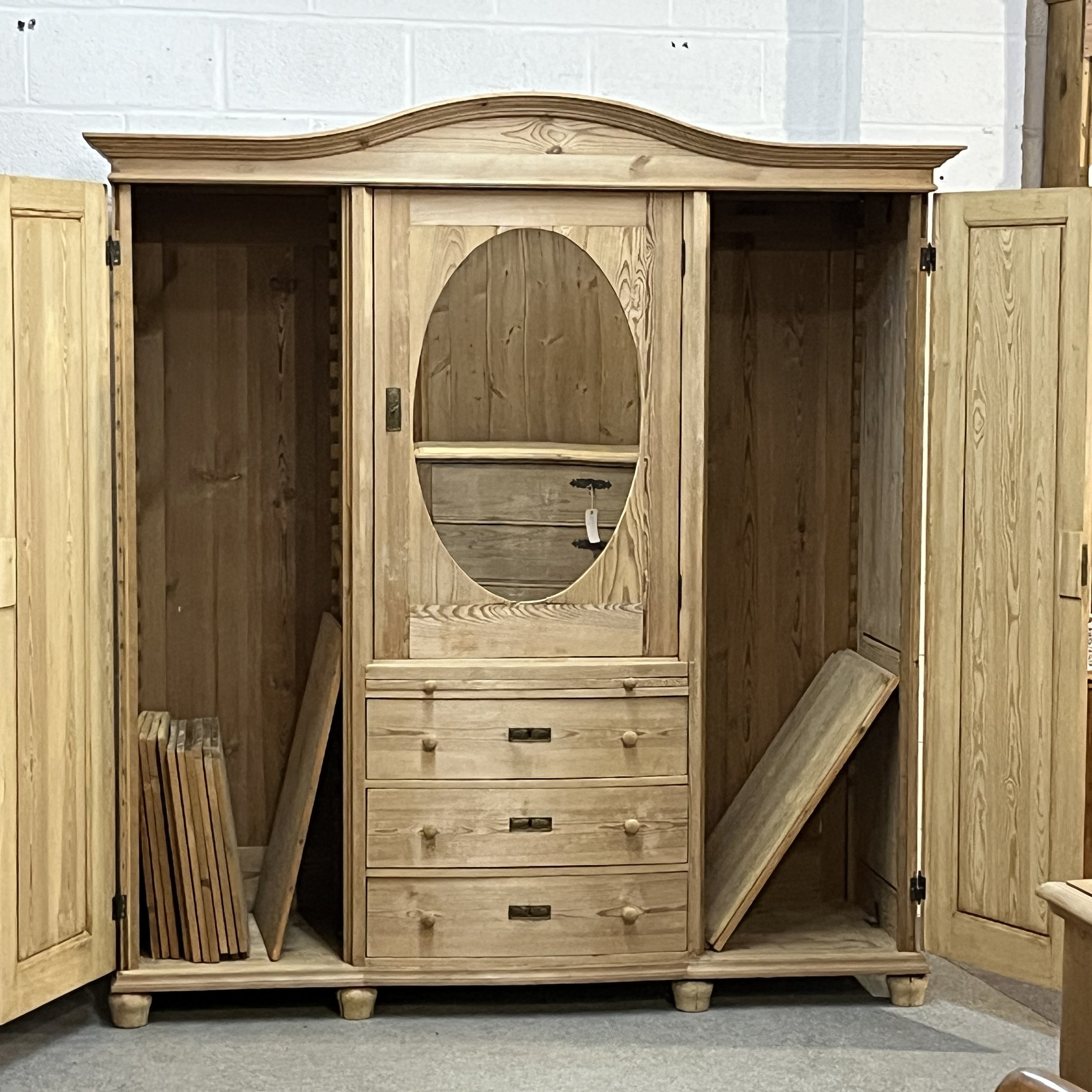 N4105H wardrobe with both tall side doors open, showing loose shelving inside