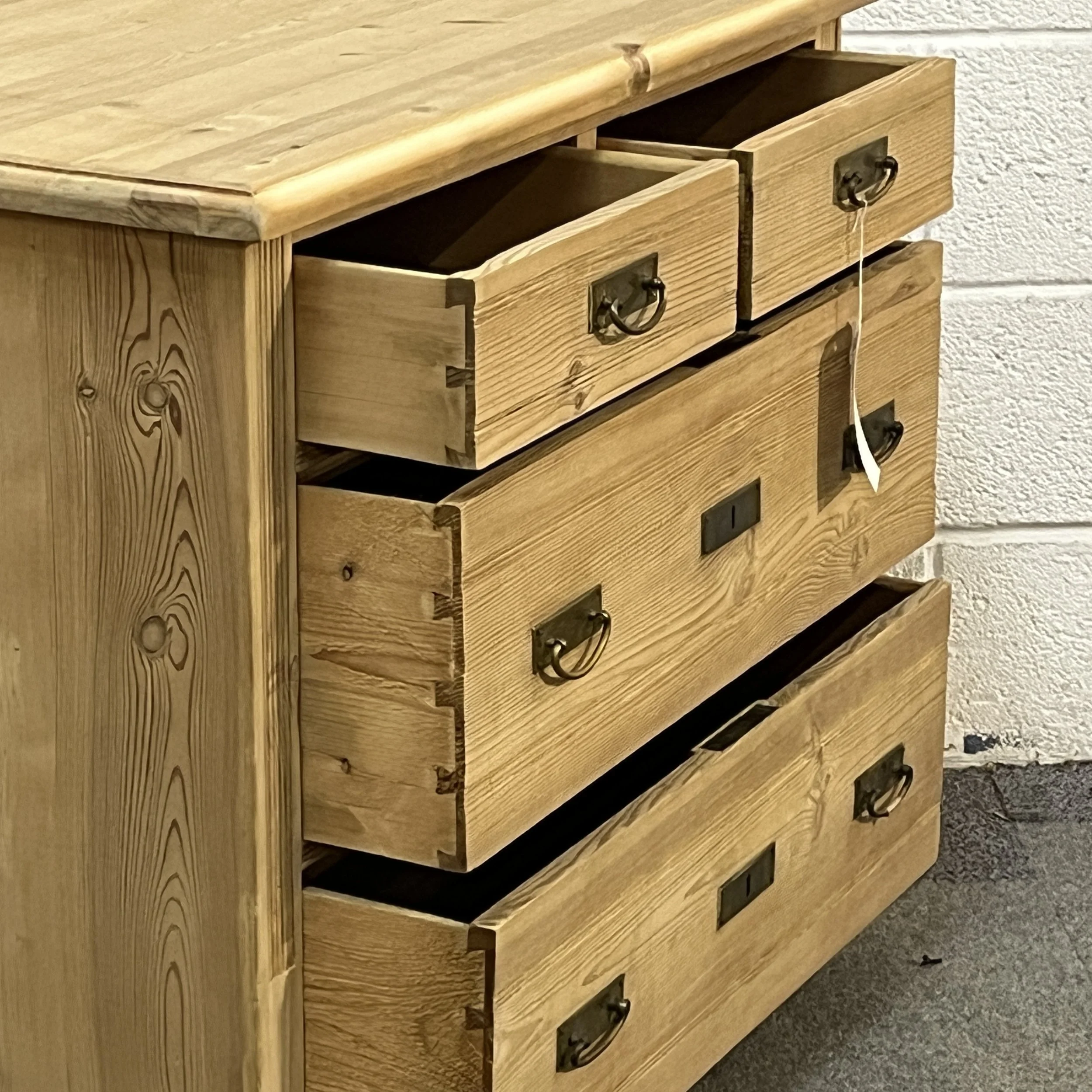 Pine chest N8004C with all four drawers partly open, showing interiors and dovetail joints.